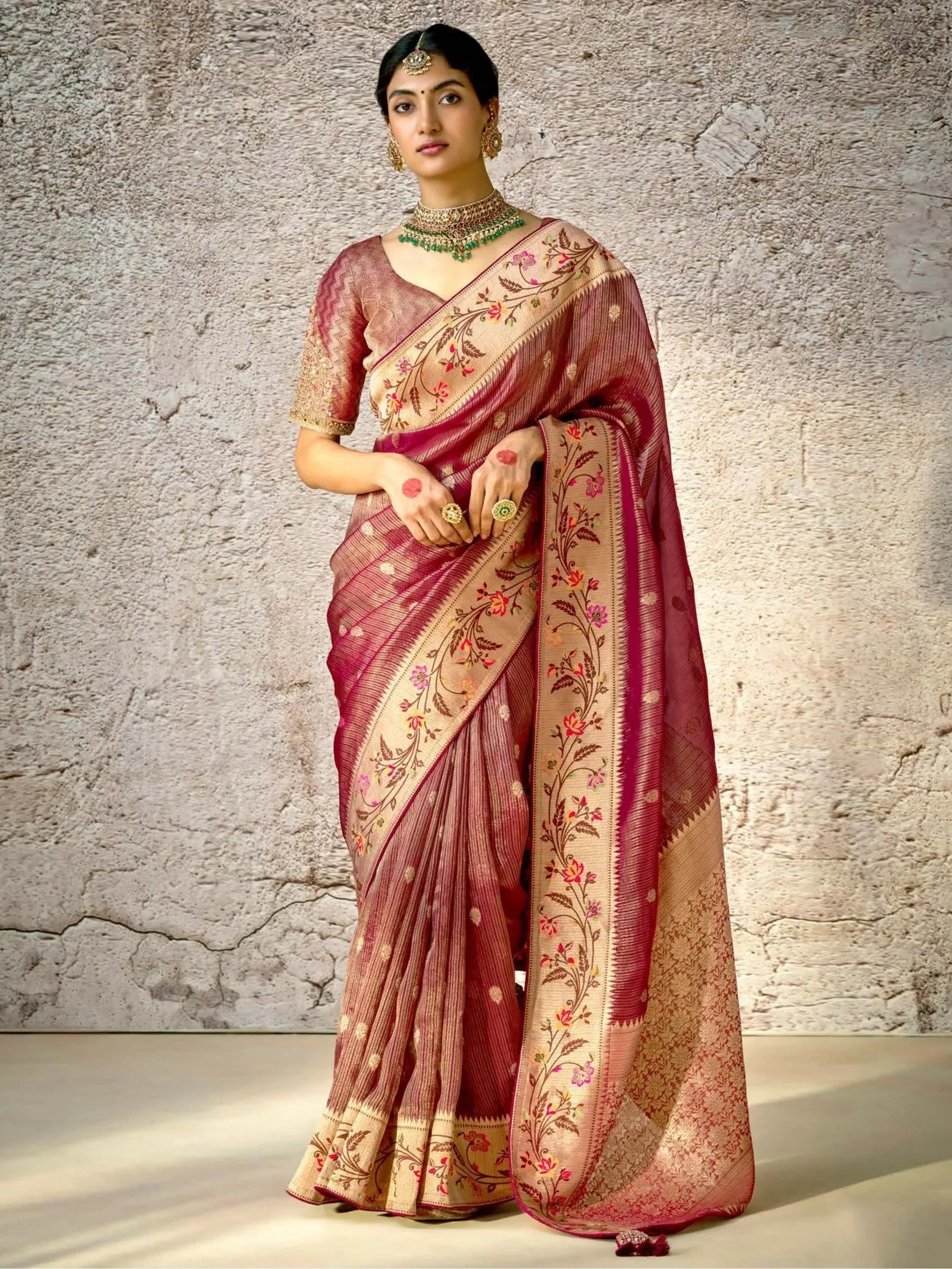 Woman in maroon floral embroidered saree with gold blouse, traditional Indian ethnic wear