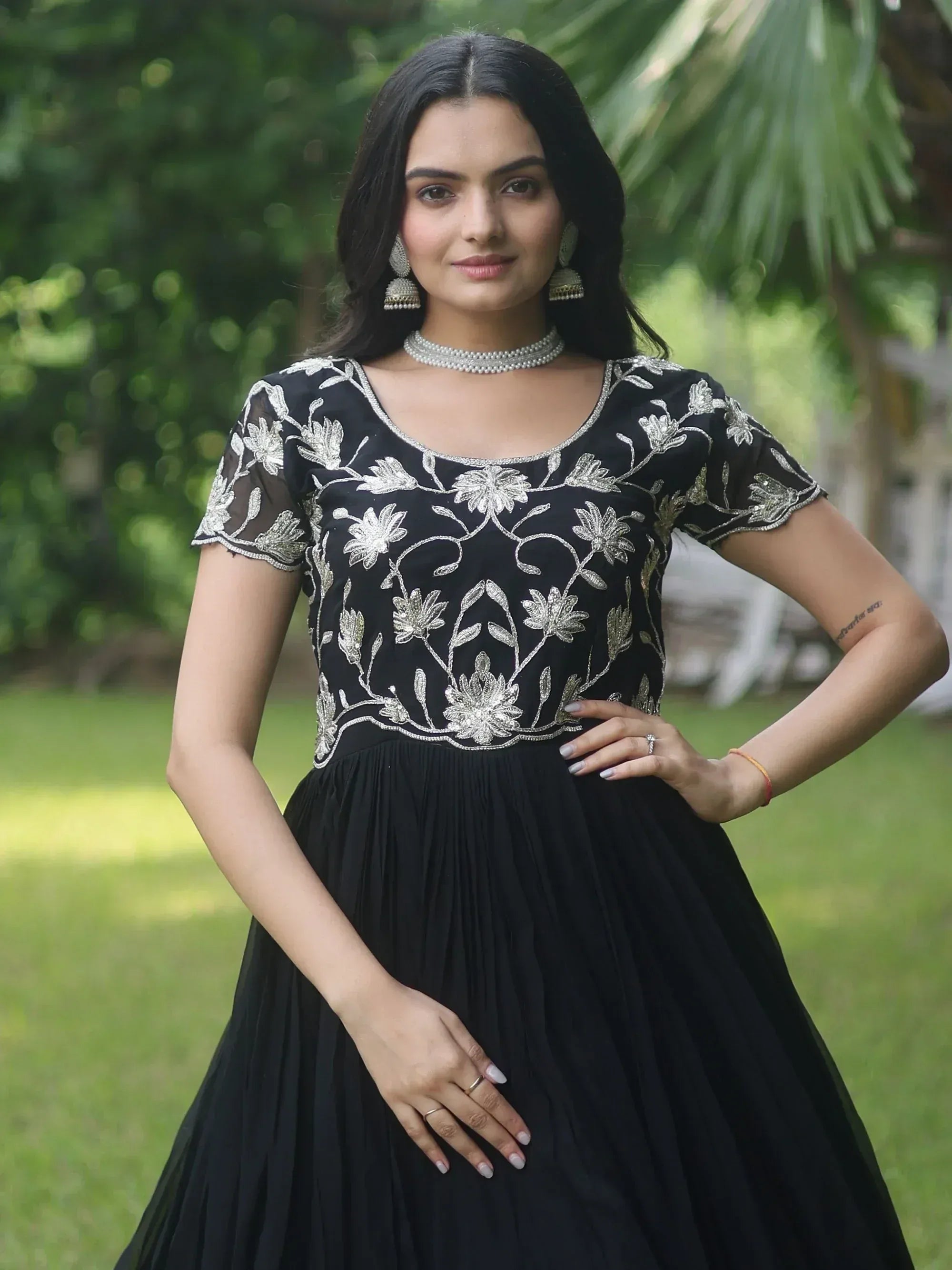 Black ethnic gown with silver floral embroidery, perfect for Indian occasions and events.