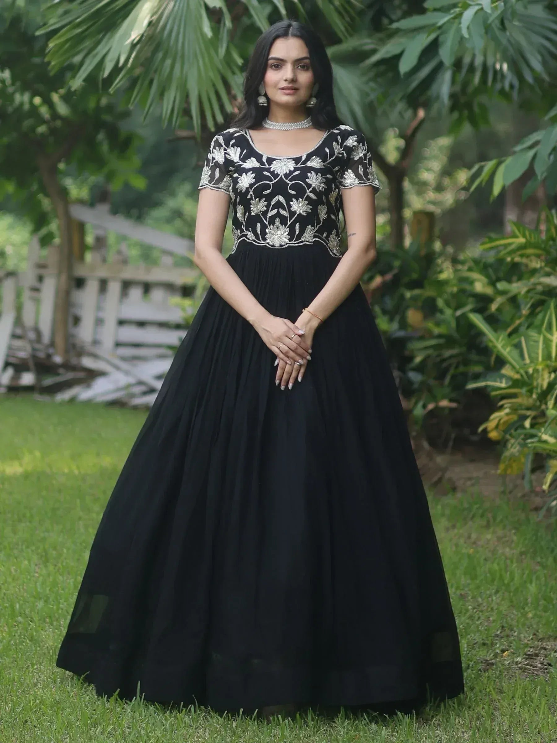 Black ethnic gown with silver floral embroidery, perfect for Indian occasions and events.