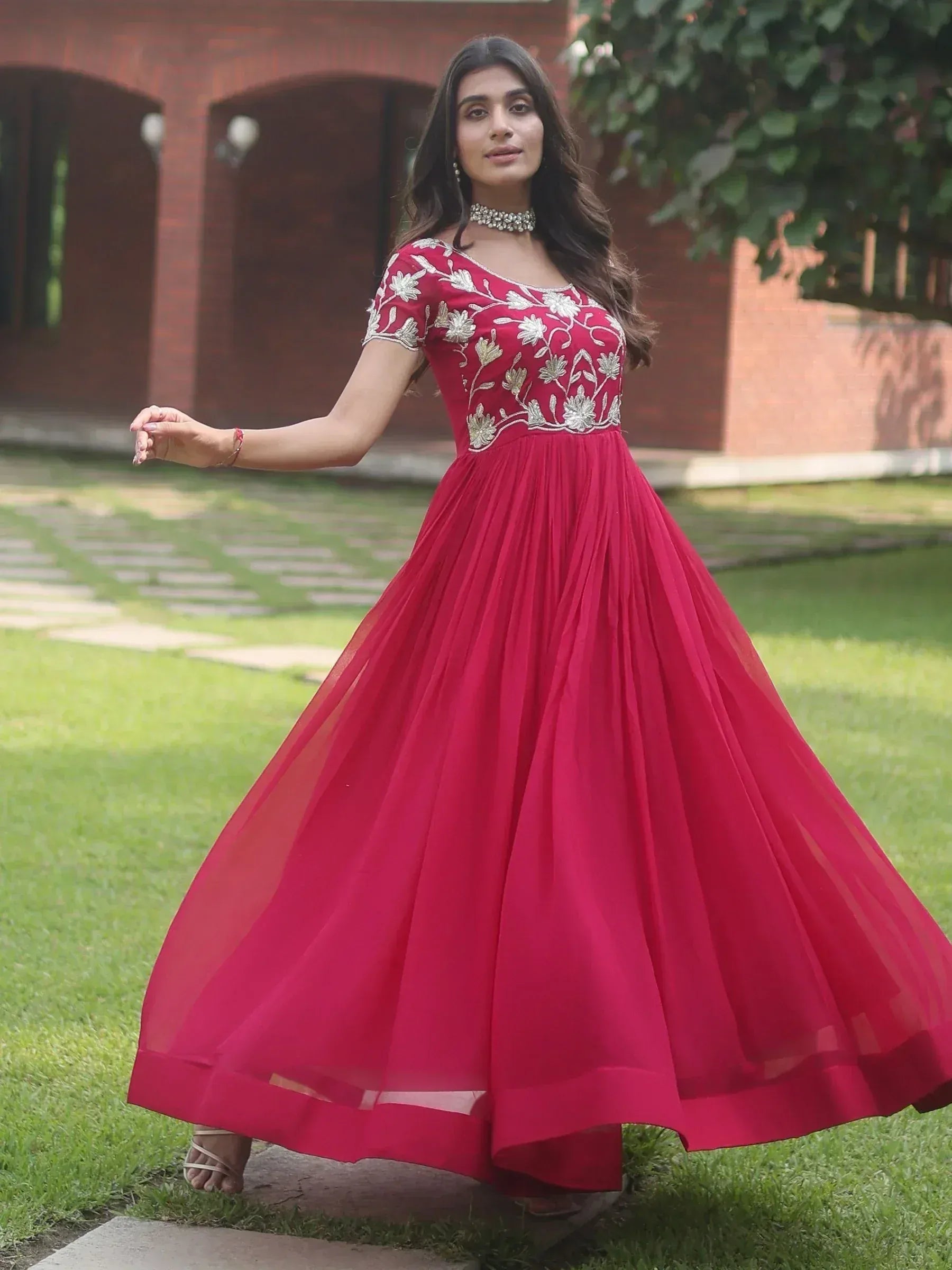 Red ethnic gown with silver floral embroidery, perfect for Indian occasions and festive wear.