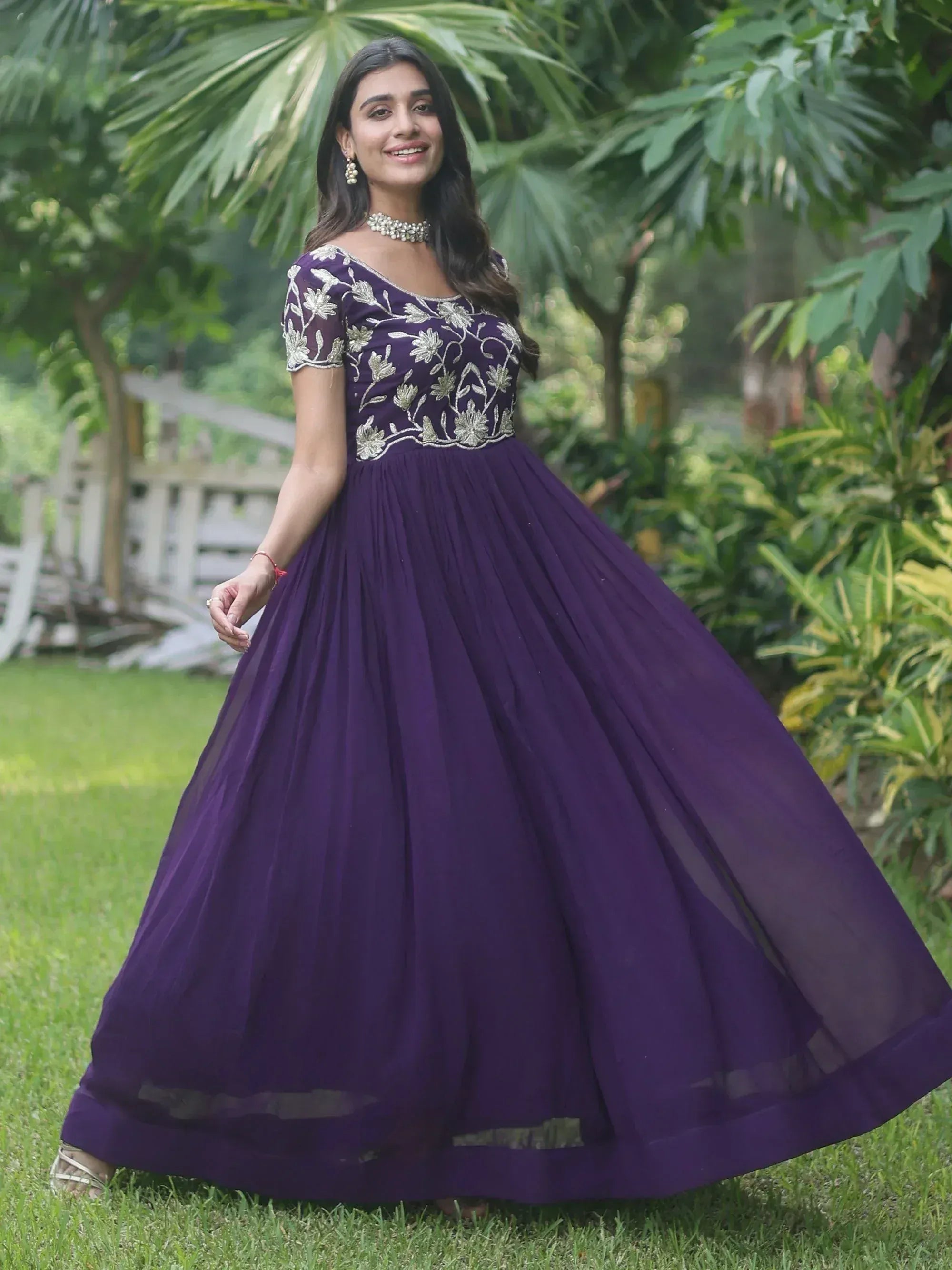 Purple ethnic gown with gold floral embroidery, perfect for Indian weddings and parties