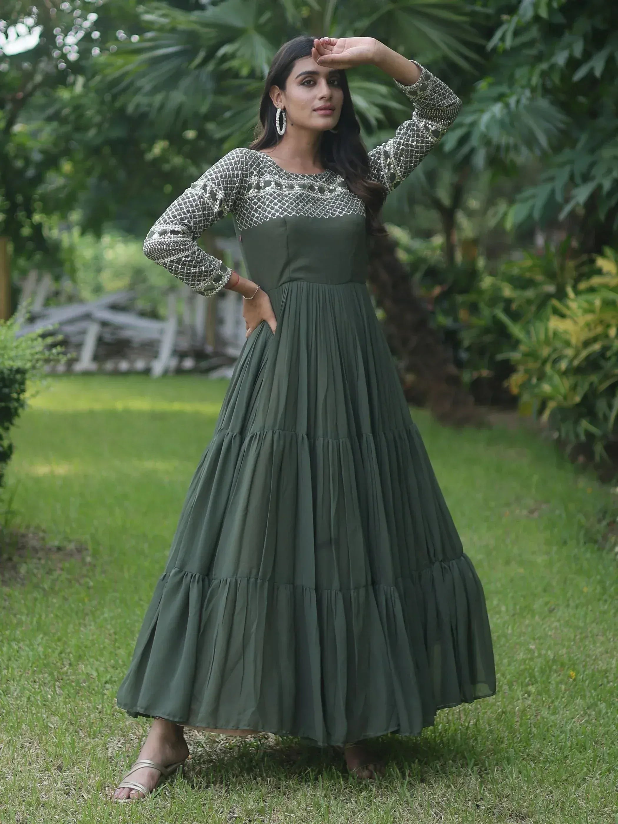 Olive green ethnic gown with embroidered long sleeves and tiered skirt, perfect for Indian occasions