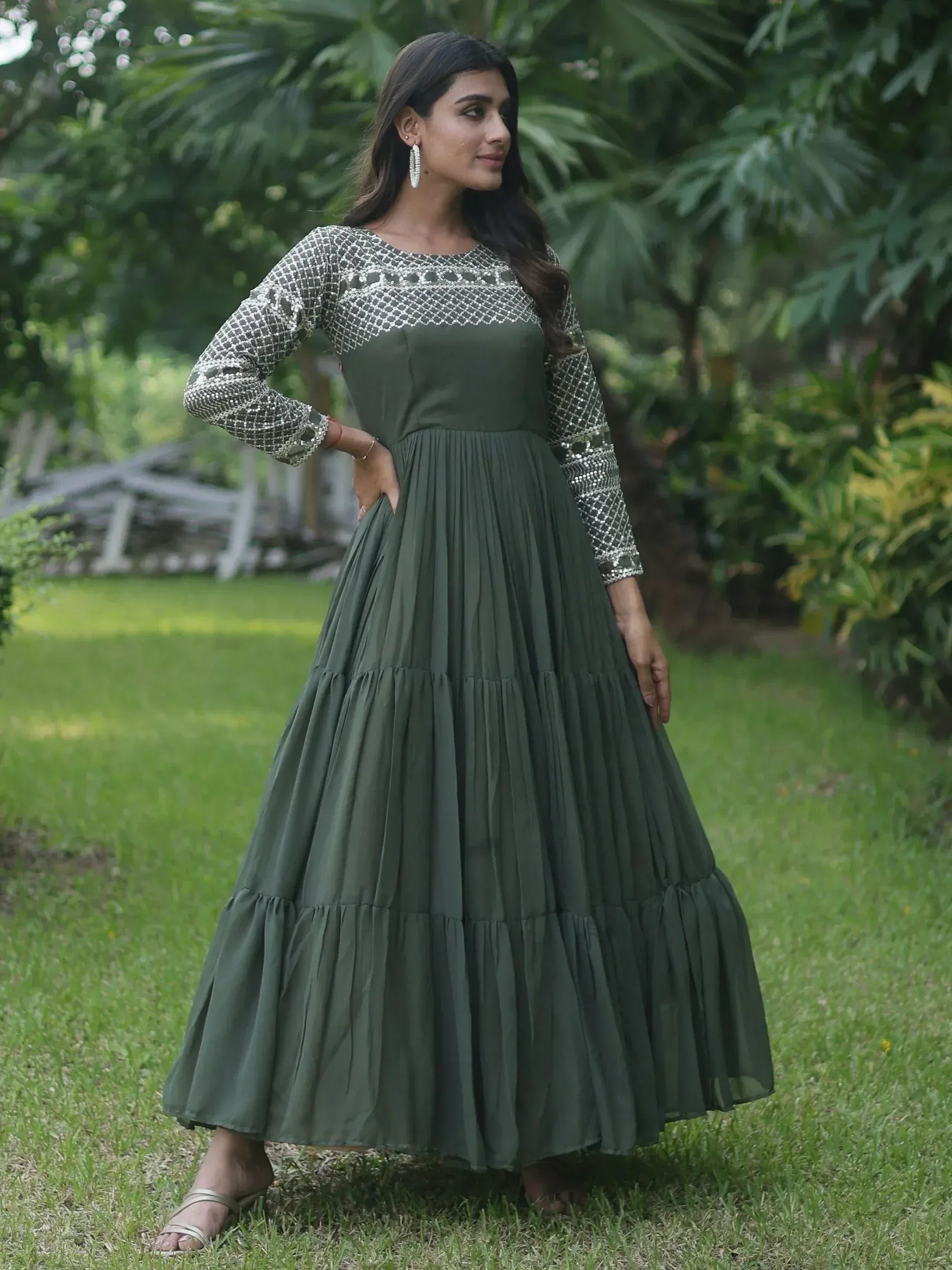 Olive green ethnic gown with sequin sleeves and pleated skirt, perfect for Indian occasions