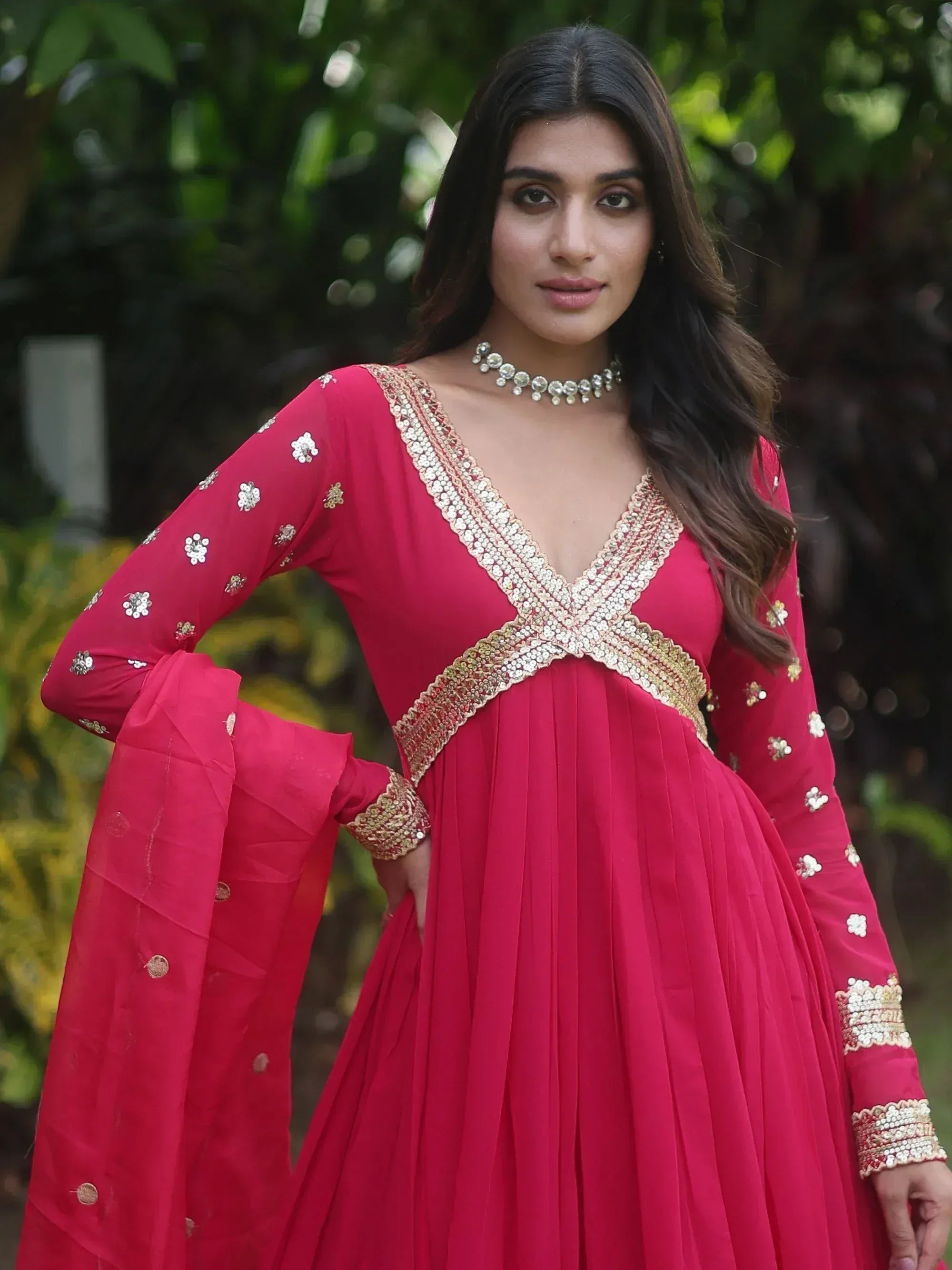 Red ethnic anarkali gown with gold embroidery, perfect for Indian weddings and festive occasions