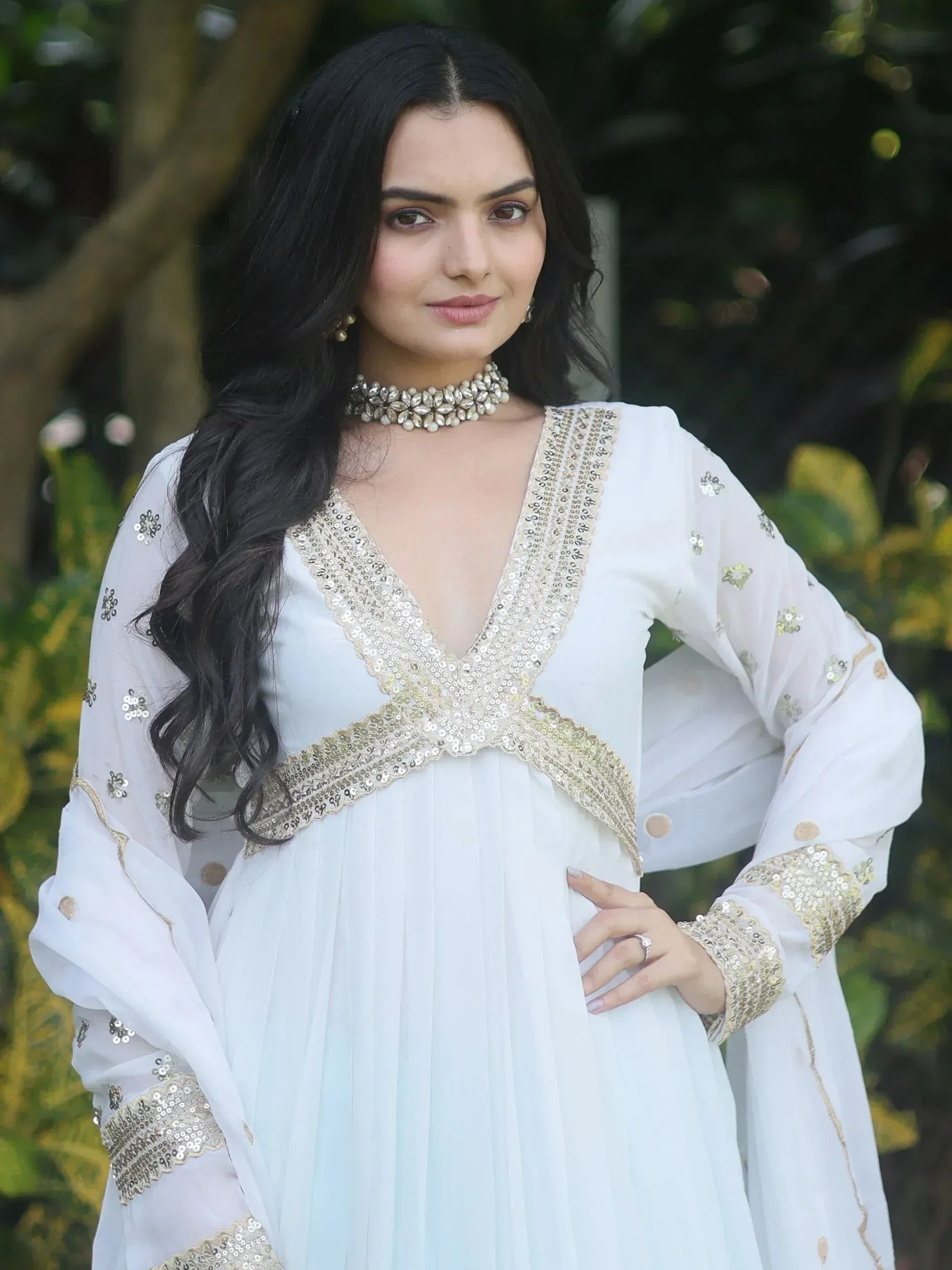 White ethnic gown with gold sequin embroidery, perfect for Indian festive occasions and weddings.