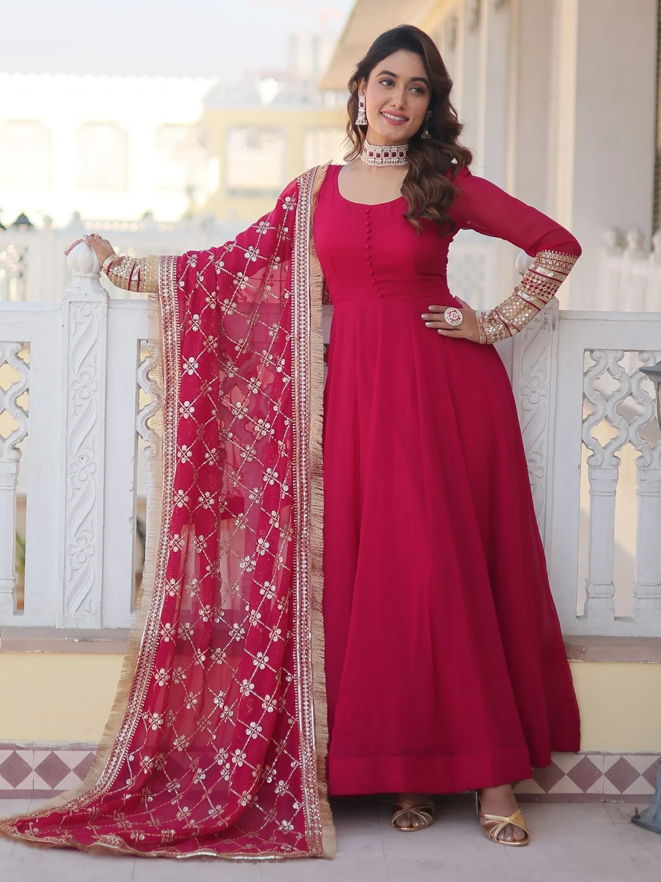 Woman in pink Anarkali suit with embroidered dupatta, traditional Indian ethnic wear