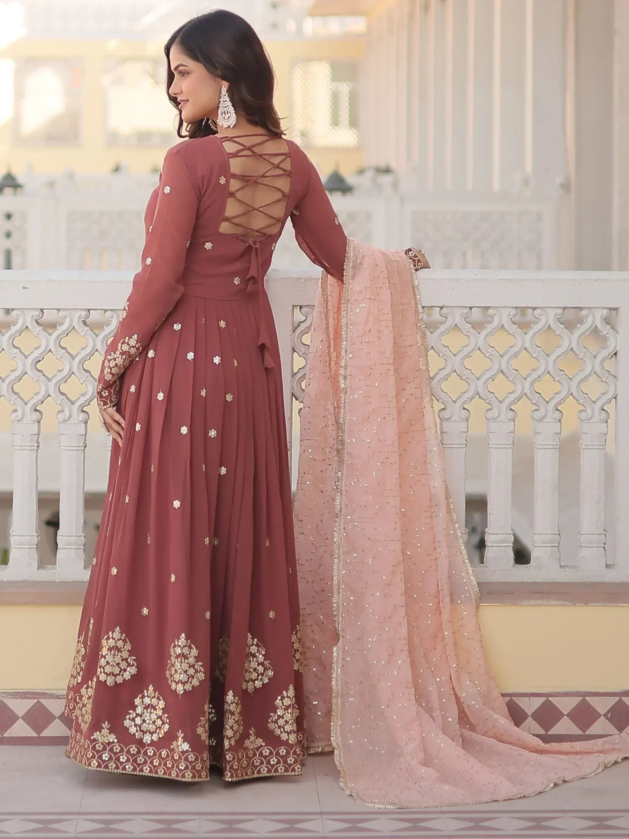 Elegant maroon anarkali with gold embroidery, criss-cross back, and pink sequin dupatta for Indian ethnic wear