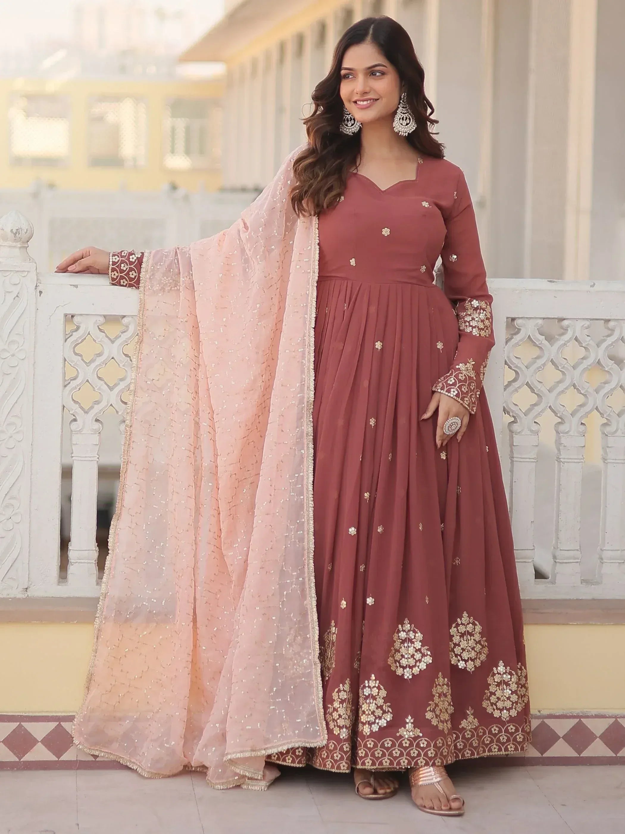 Elegant maroon anarkali with gold embroidery and pink dupatta, perfect for Indian ethnic occasions
