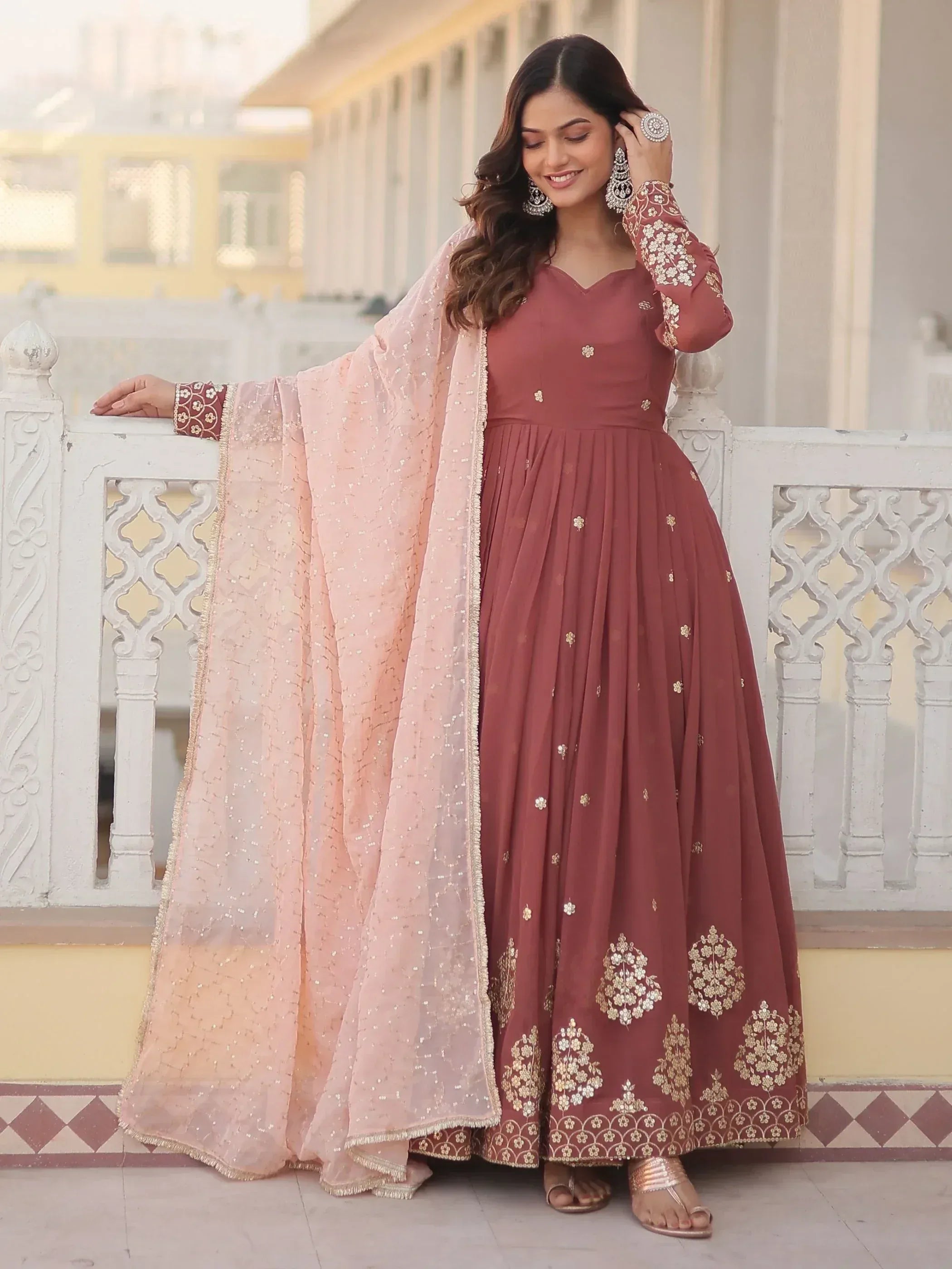 Elegant maroon anarkali with gold embroidery and pink dupatta, perfect for Indian ethnic occasions