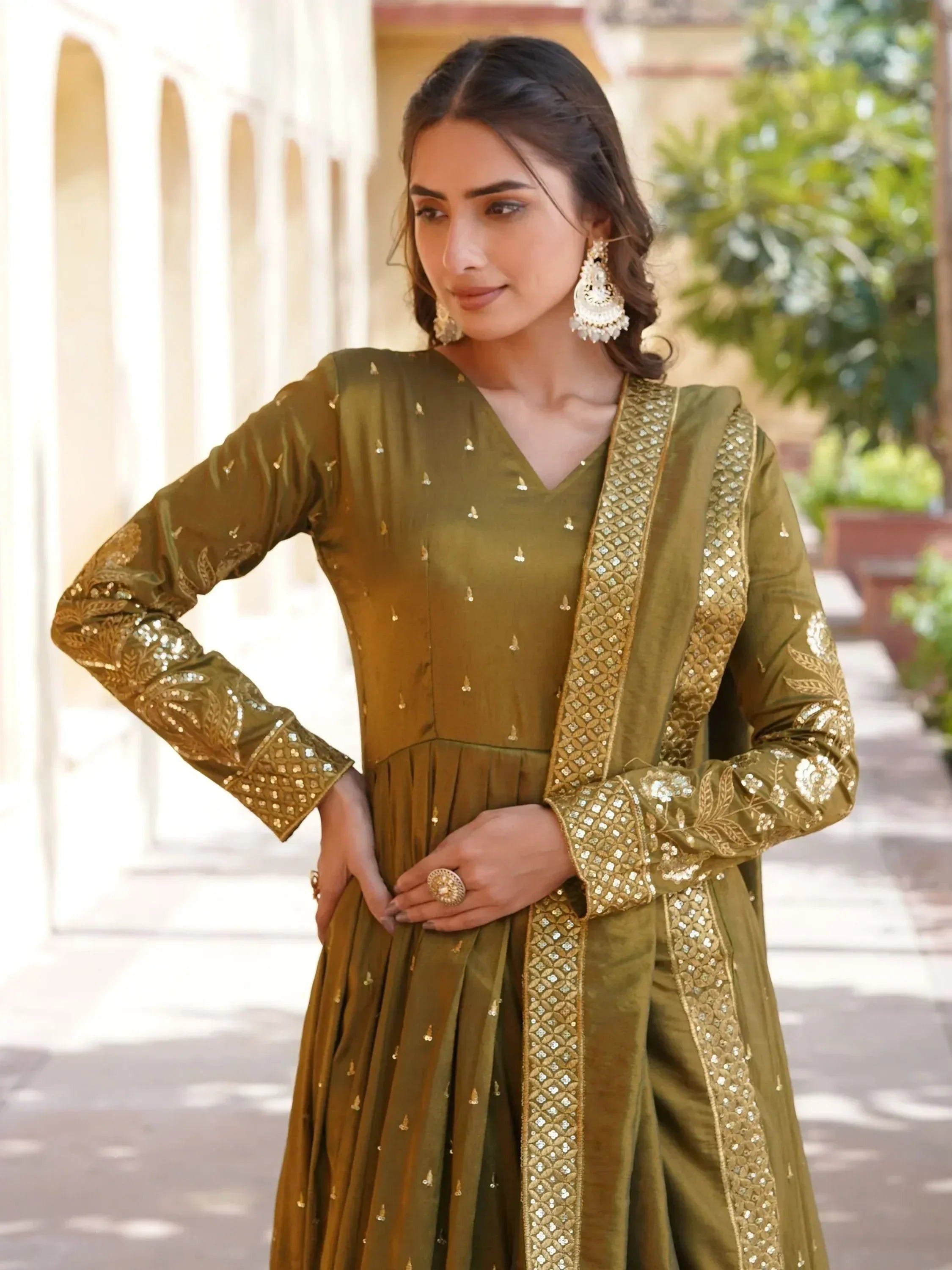 Olive green ethnic anarkali suit with gold embroidery and sequins, perfect for Indian occasions