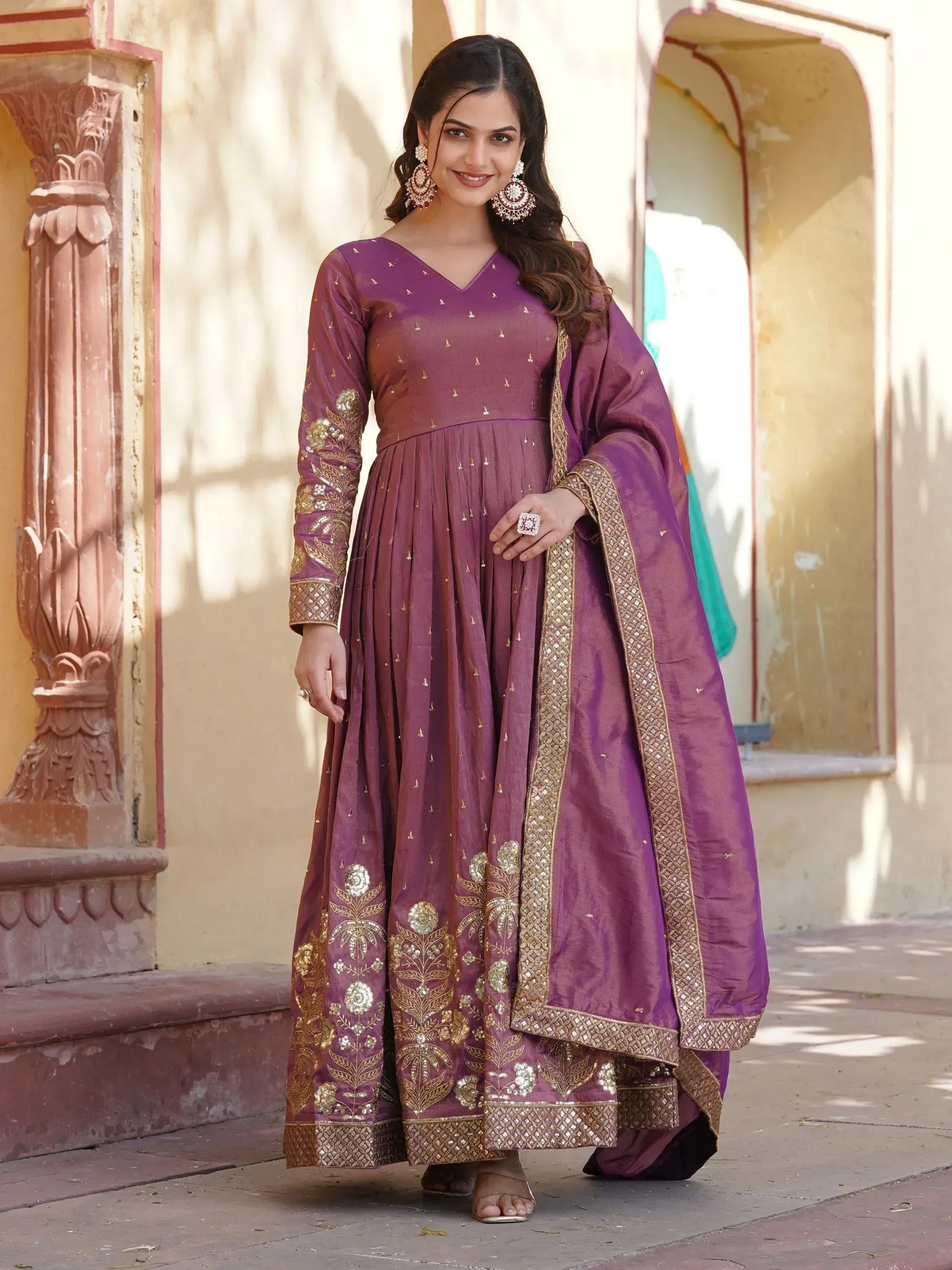 Purple ethnic anarkali suit with gold embroidery, perfect for Indian weddings and festive occasions