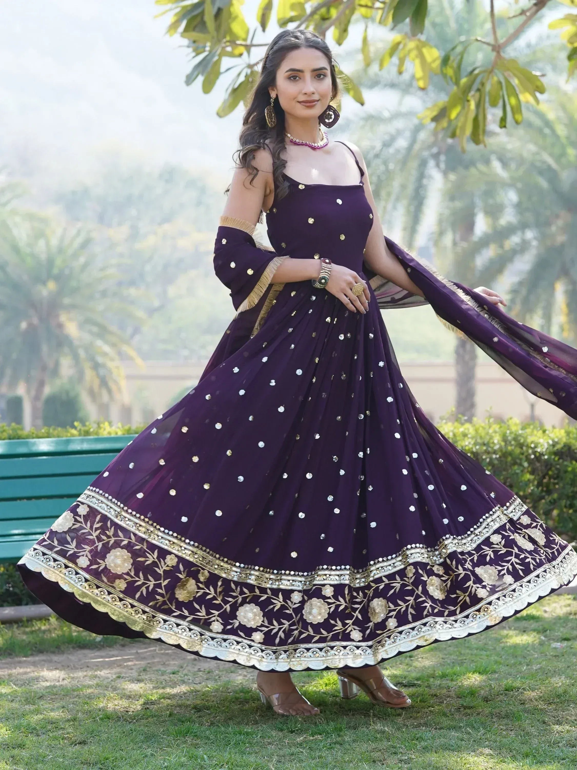 Purple ethnic gown with gold floral embroidery and mirror work, perfect for Indian occasions