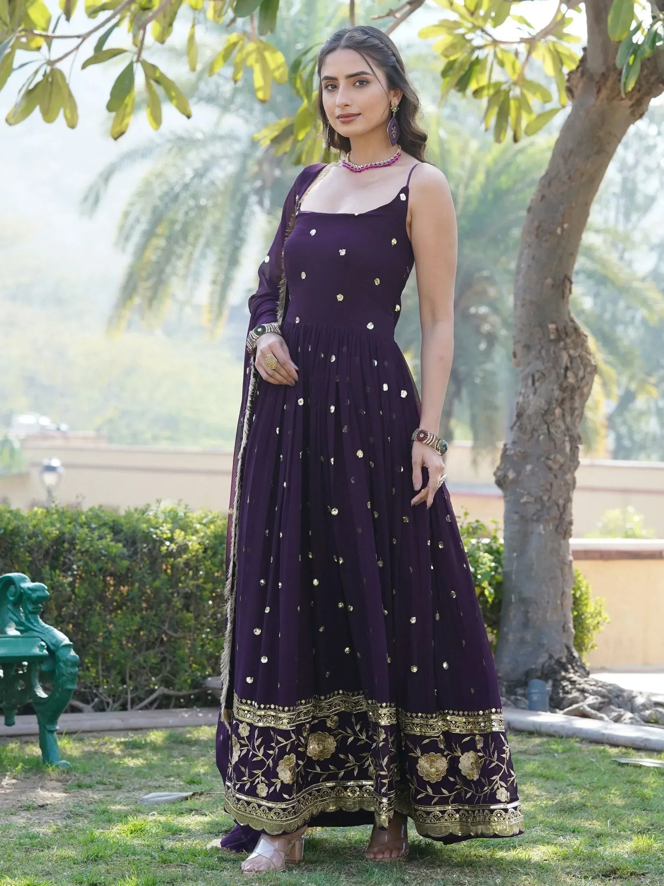 Purple ethnic gown with gold embroidery, perfect for Indian occasions and festive wear.