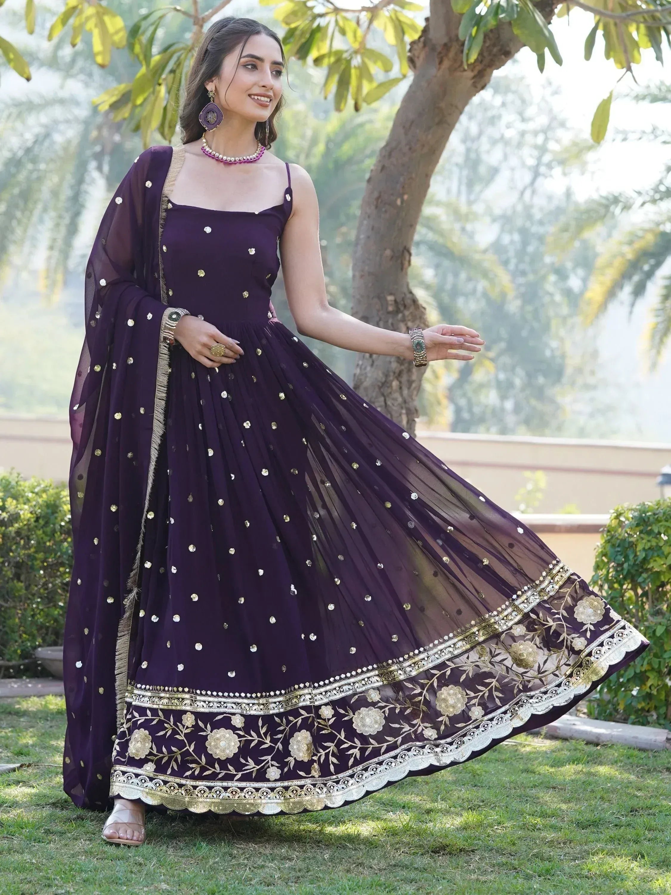 Purple designer anarkali gown with gold embroidery, perfect for Indian ethnic wear events