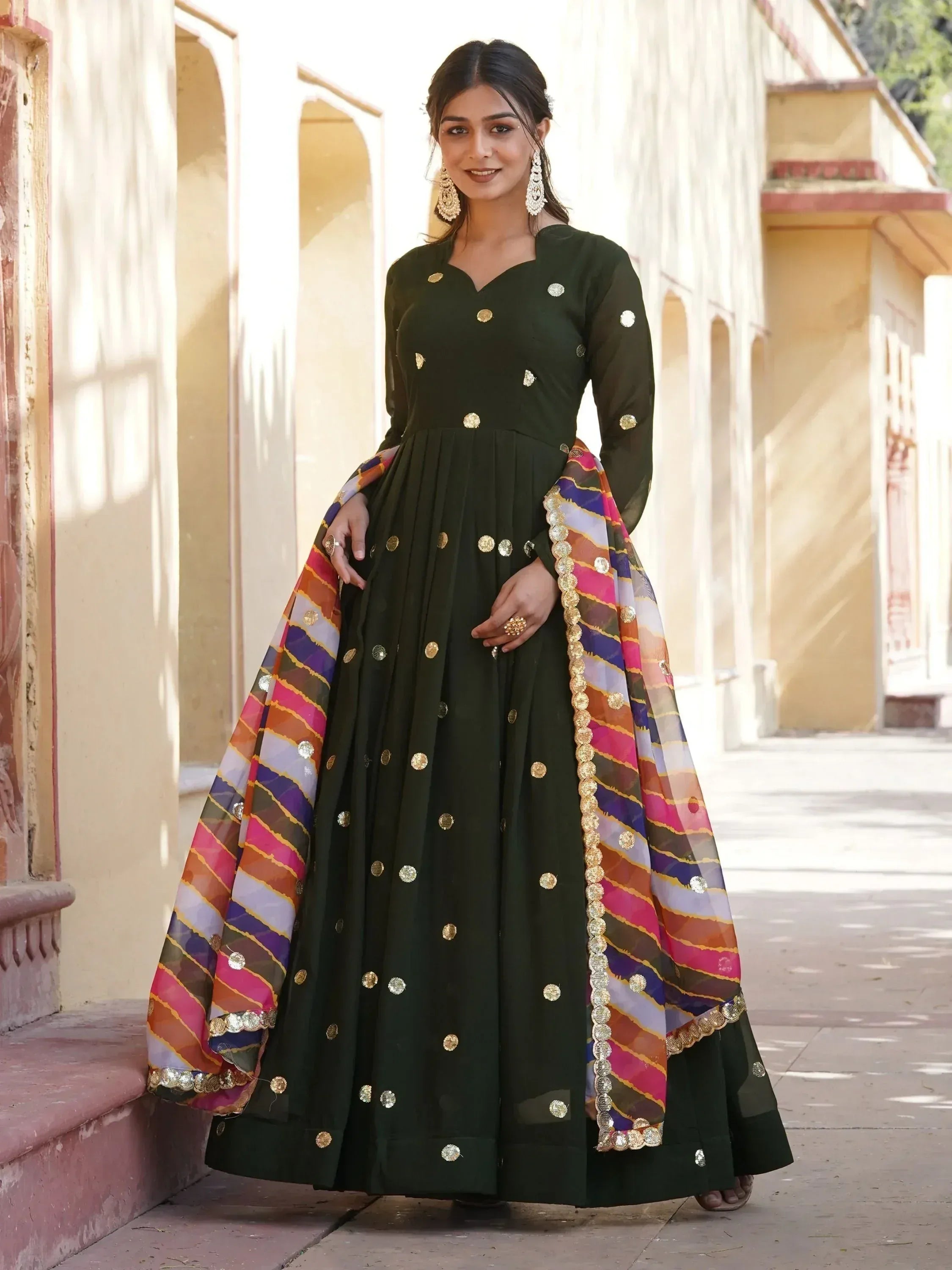 Green ethnic anarkali with gold mirror work and colorful dupatta, perfect for Indian occasions
