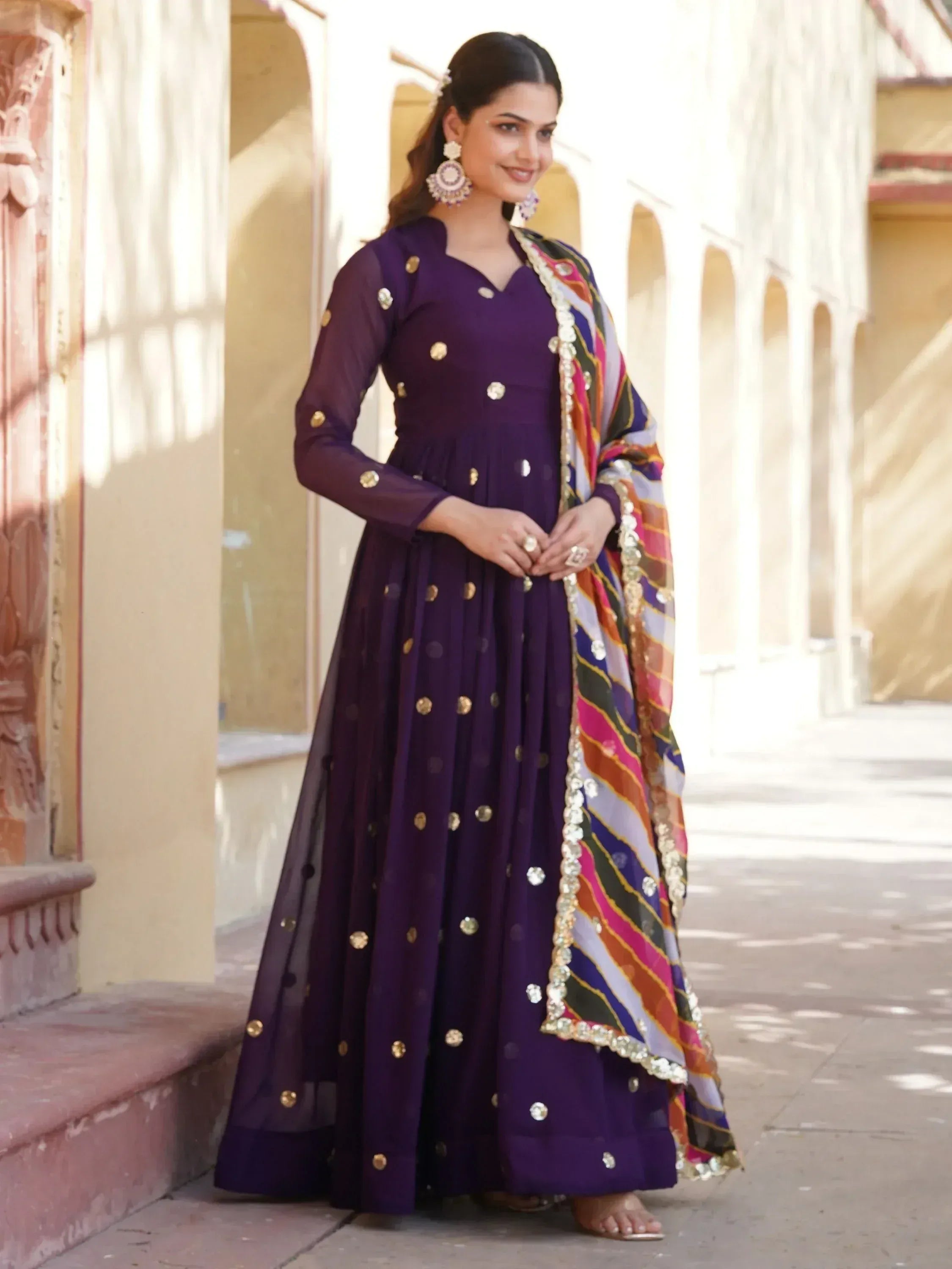 Purple ethnic anarkali with gold embellishments and colorful dupatta, perfect for Indian occasions