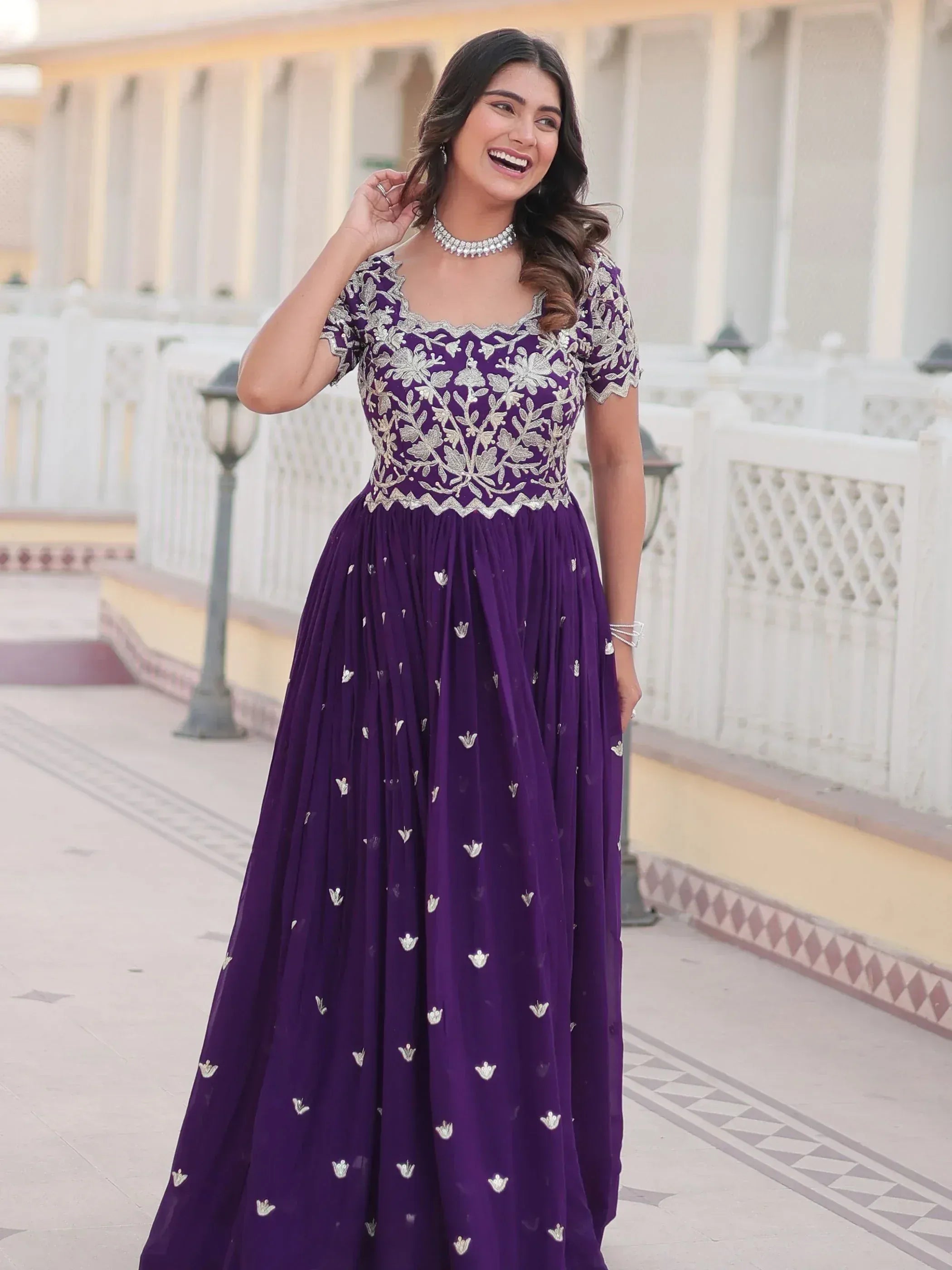 Purple embroidered ethnic gown with silver floral work, perfect for Indian occasions and weddings