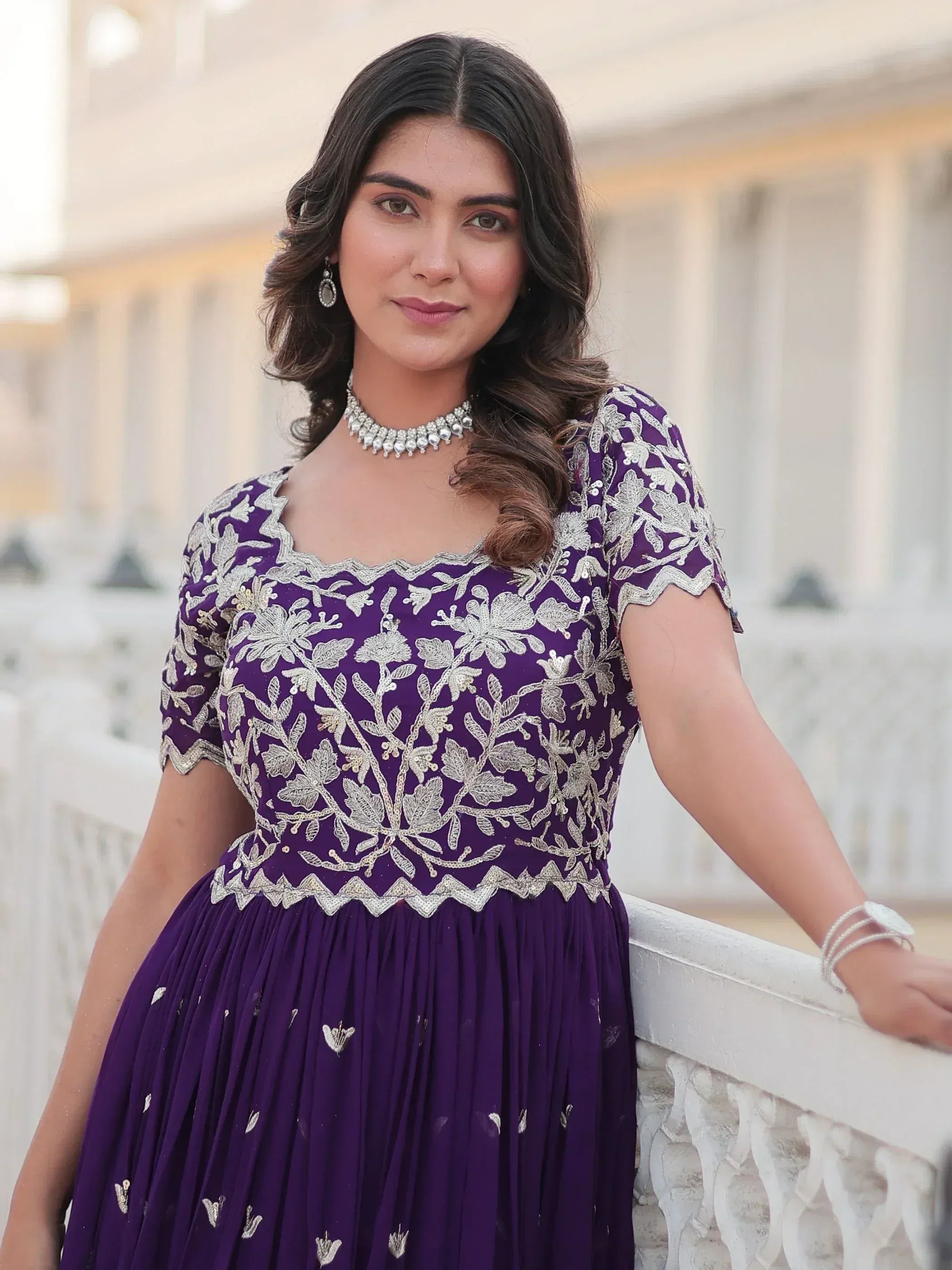 Purple ethnic gown with silver floral embroidery, perfect for Indian occasions and events.