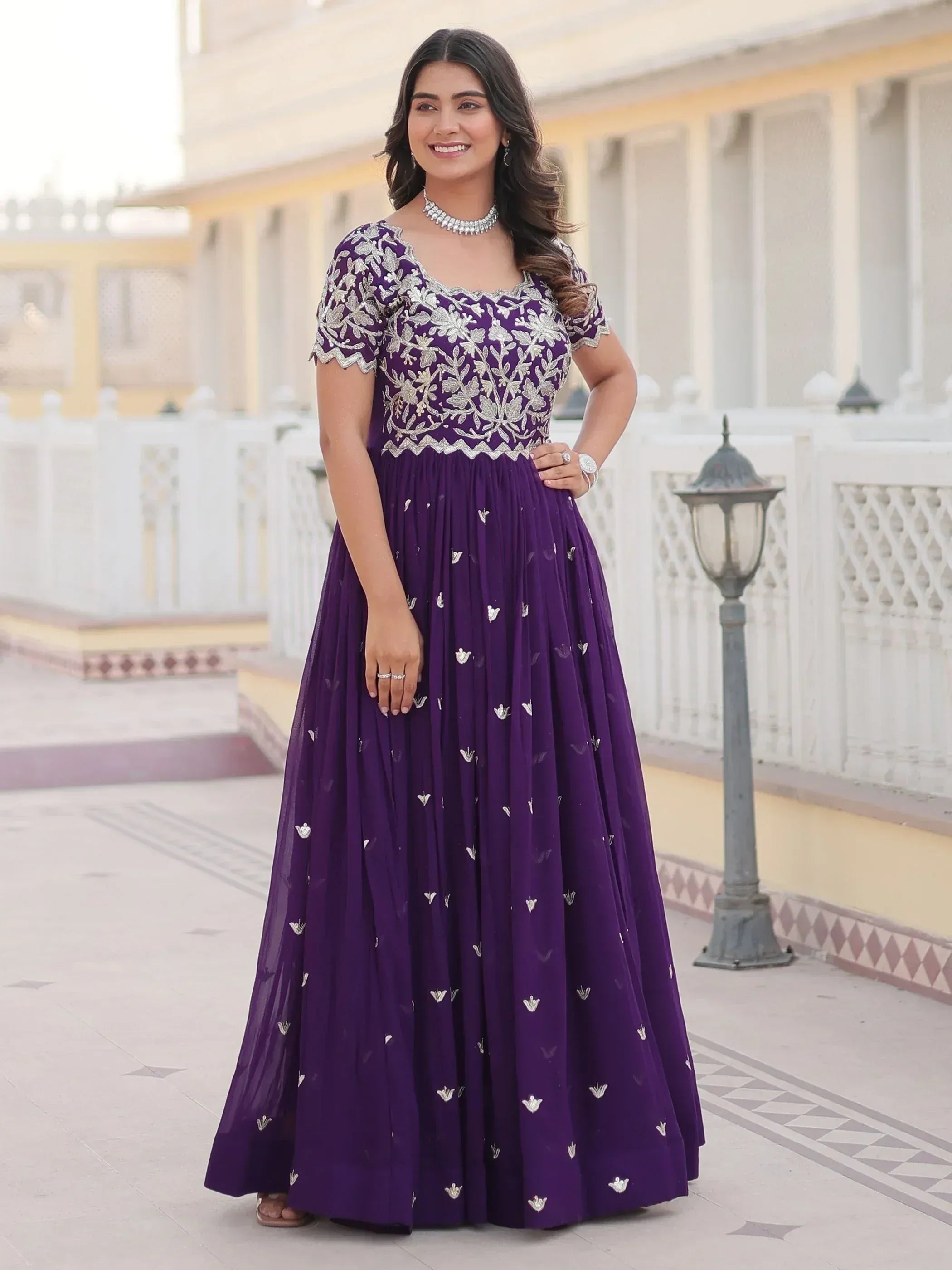 Purple embroidered ethnic gown with floral detailing, perfect for Indian occasions and parties