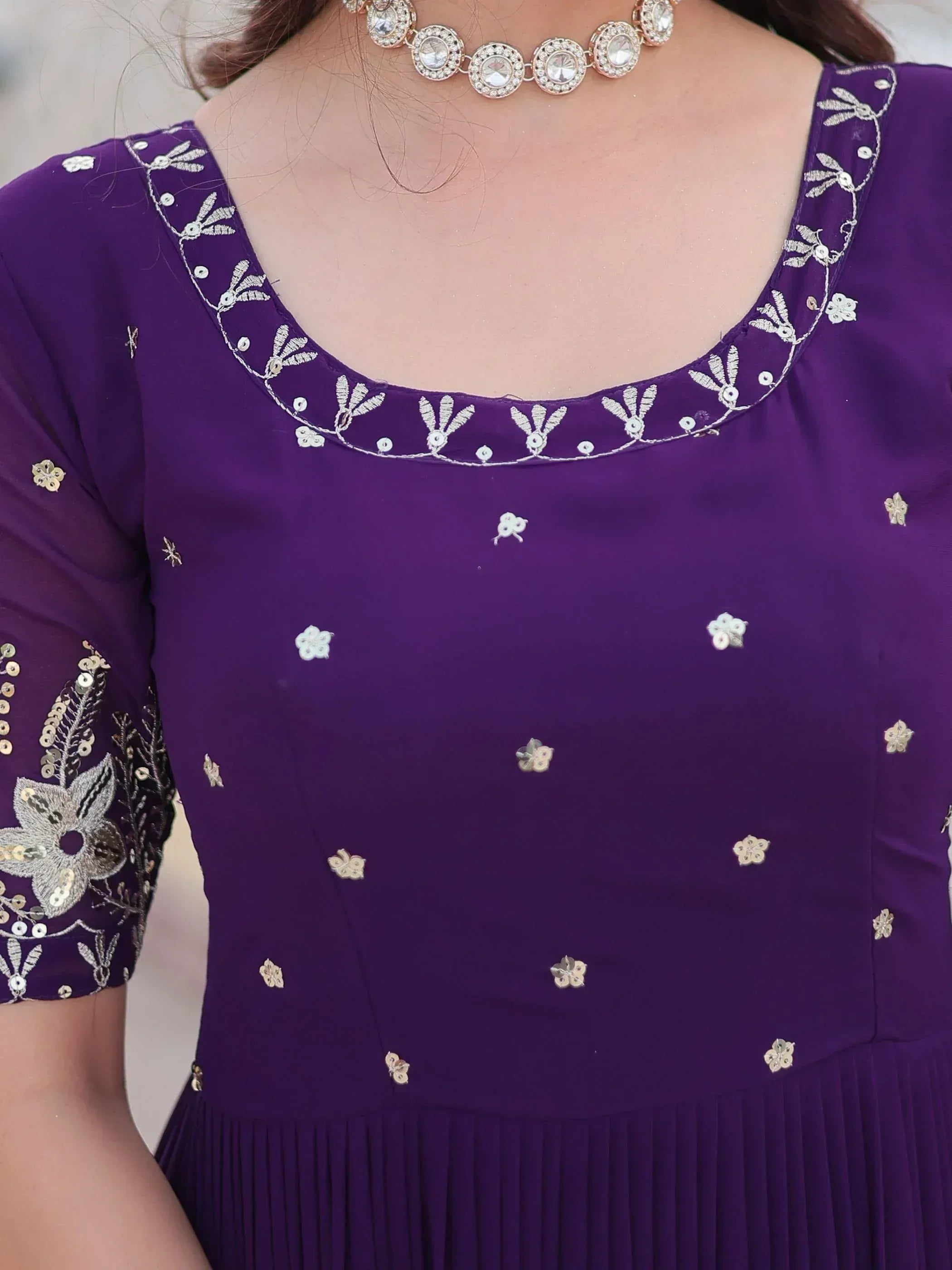 Purple ethnic gown with floral embroidery and sequin detailing, perfect for Indian festive wear