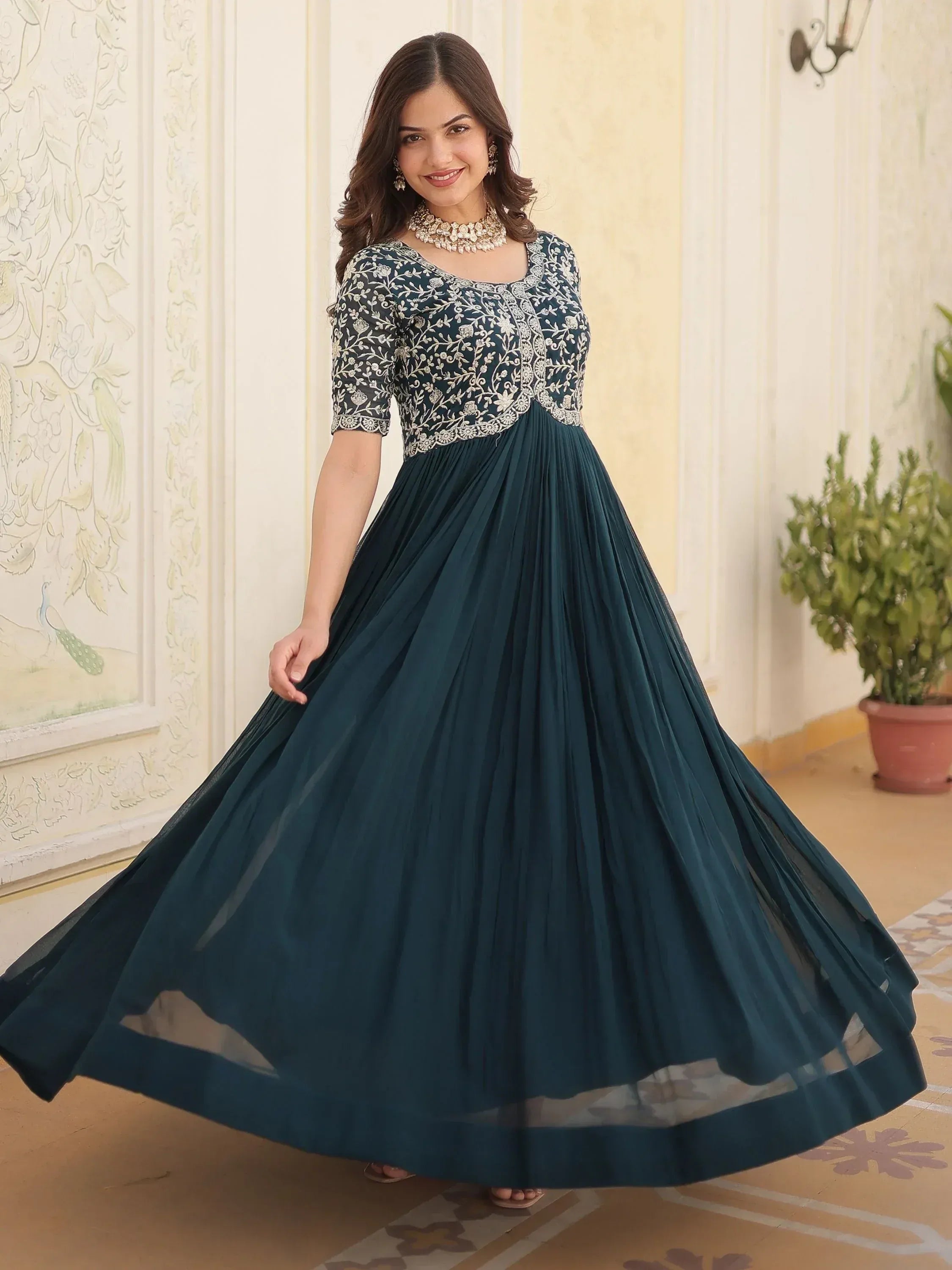 Teal ethnic gown with white floral embroidery, pleated skirt, perfect for Indian occasions