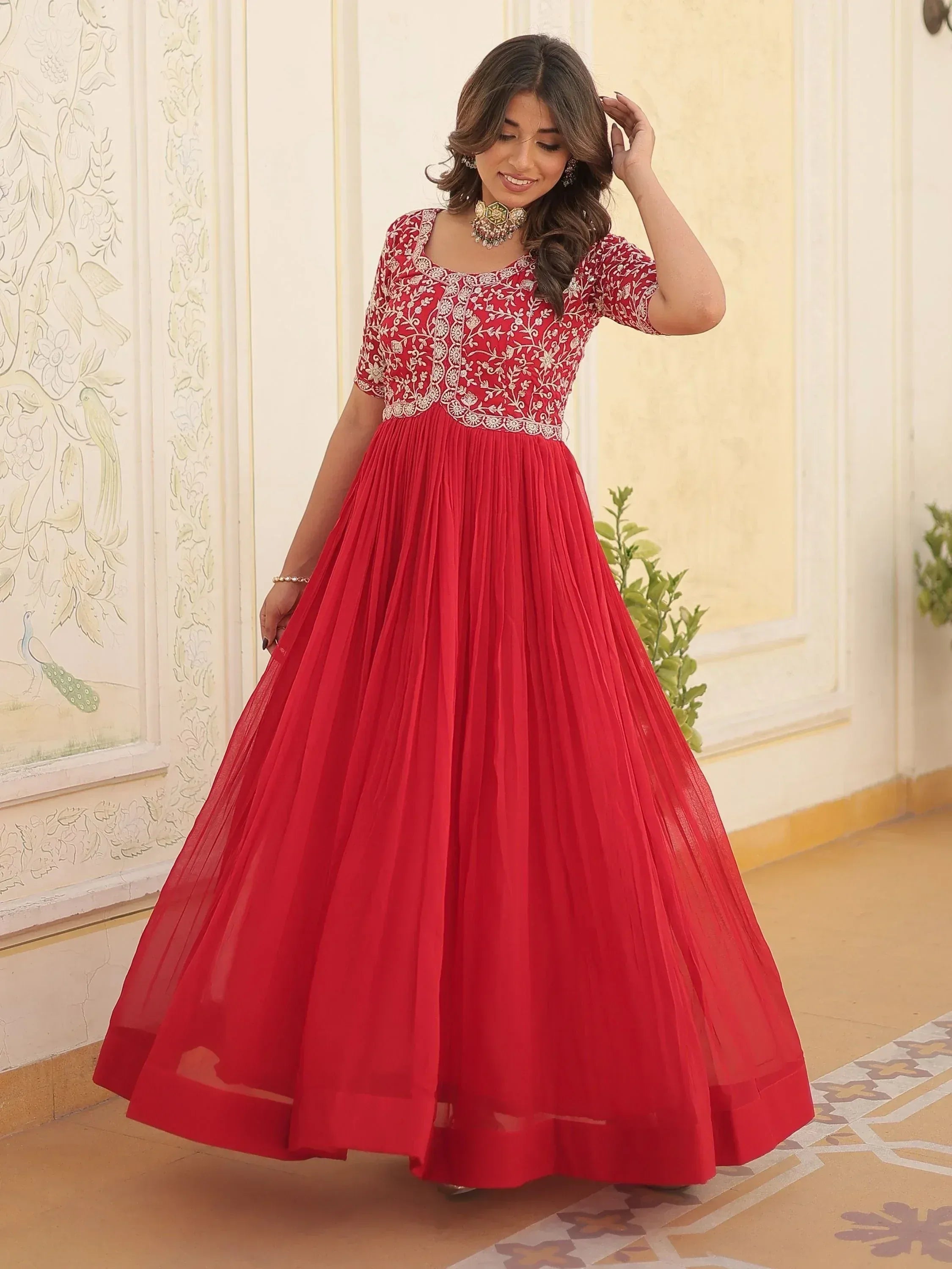 Red embroidered ethnic gown with pleated skirt, perfect for Indian occasions and festive wear