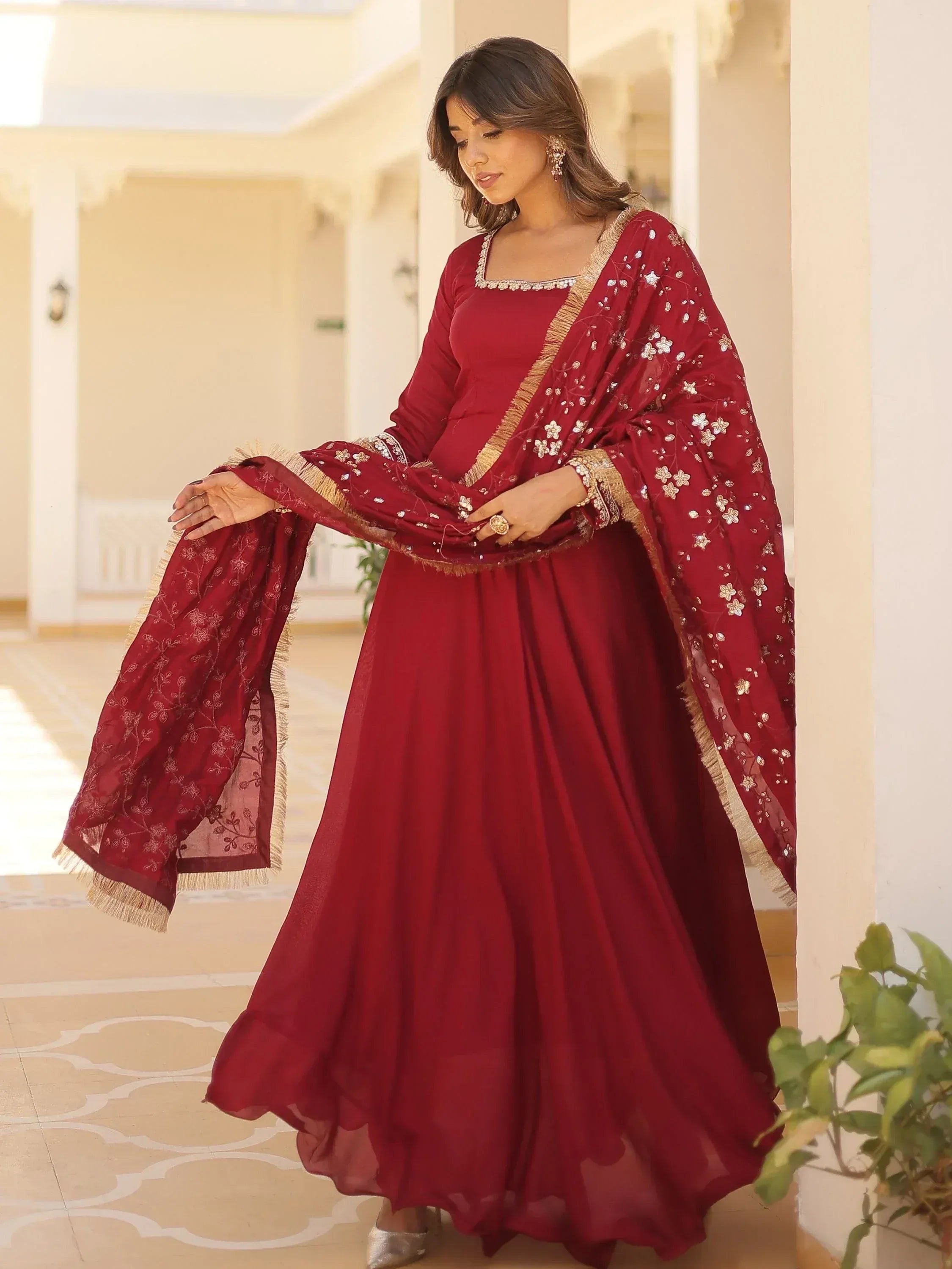 Maroon designer anarkali suit with gold embroidery and floral dupatta, ethnic Indian wear