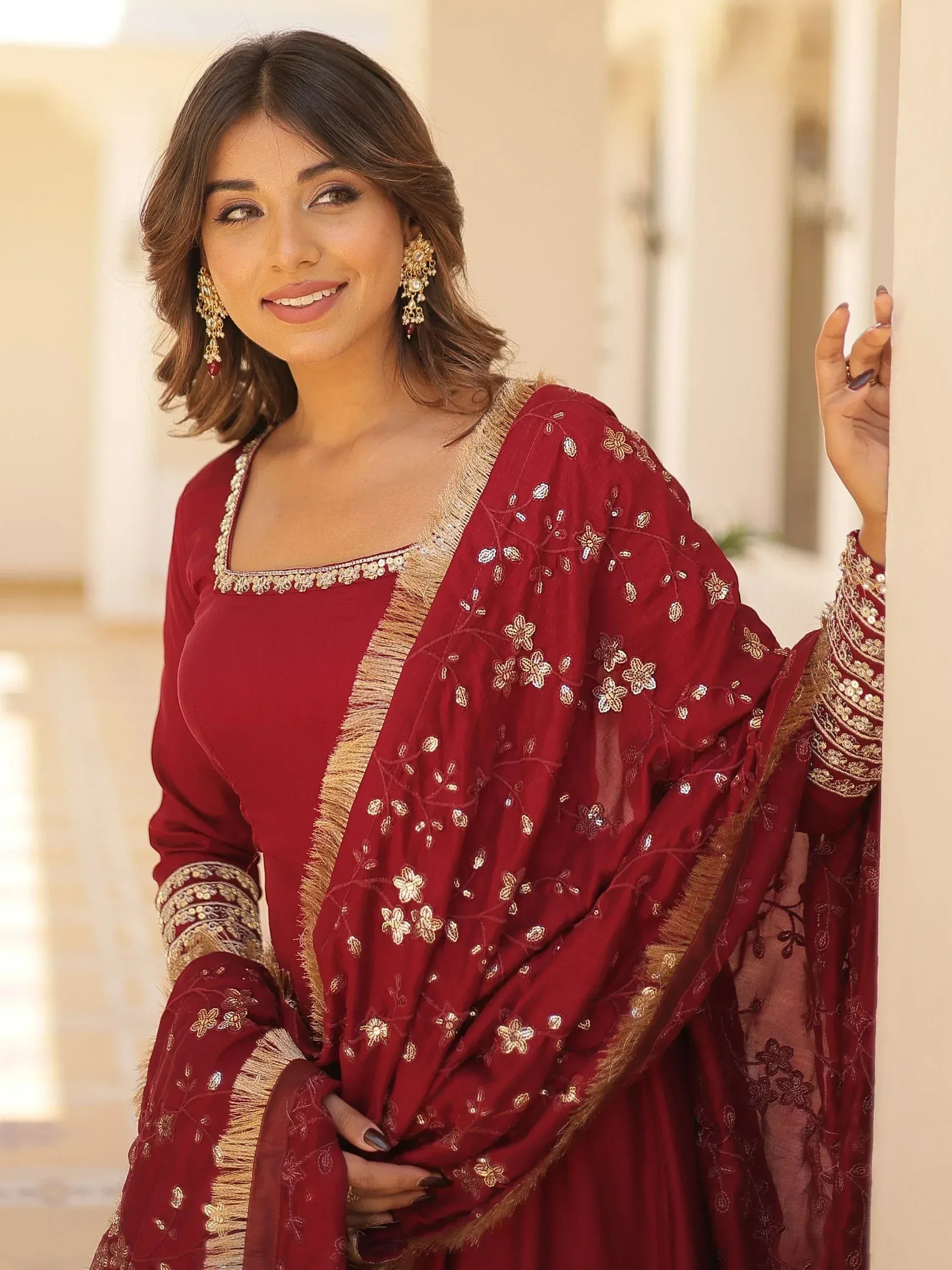 Maroon embroidered salwar kameez with gold detailing, perfect for Indian ethnic wear occasions