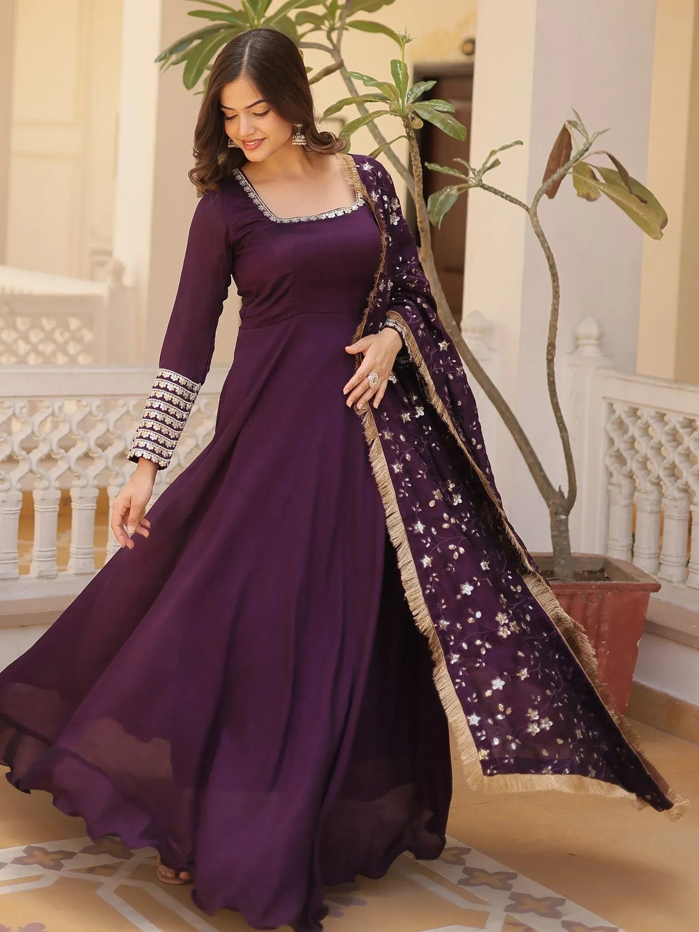 Purple designer anarkali gown with floral embroidery and gold trim, perfect for Indian ethnic occasions