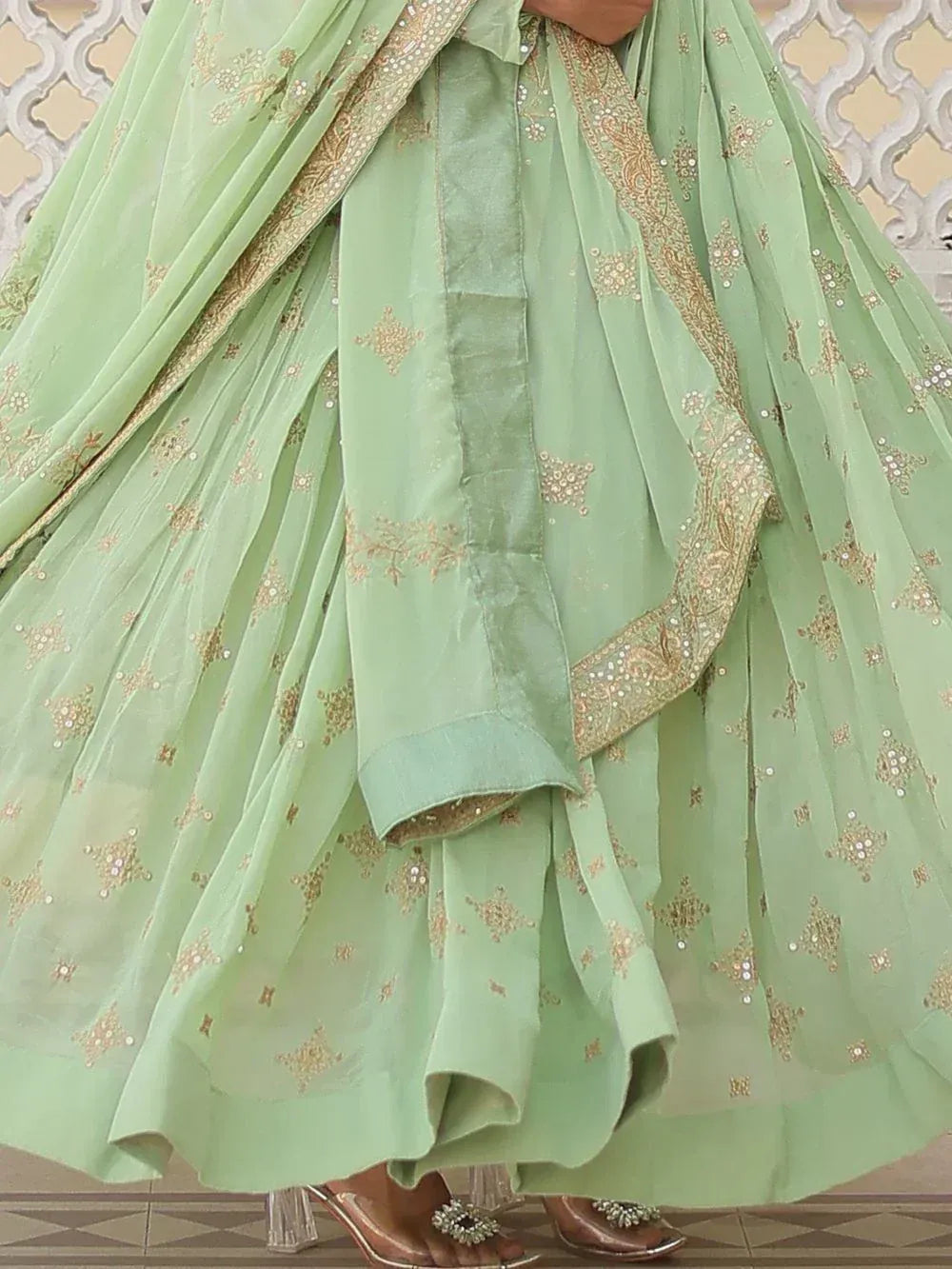 Mint green lehenga choli with gold embroidery and sequins, ethnic Indian wear