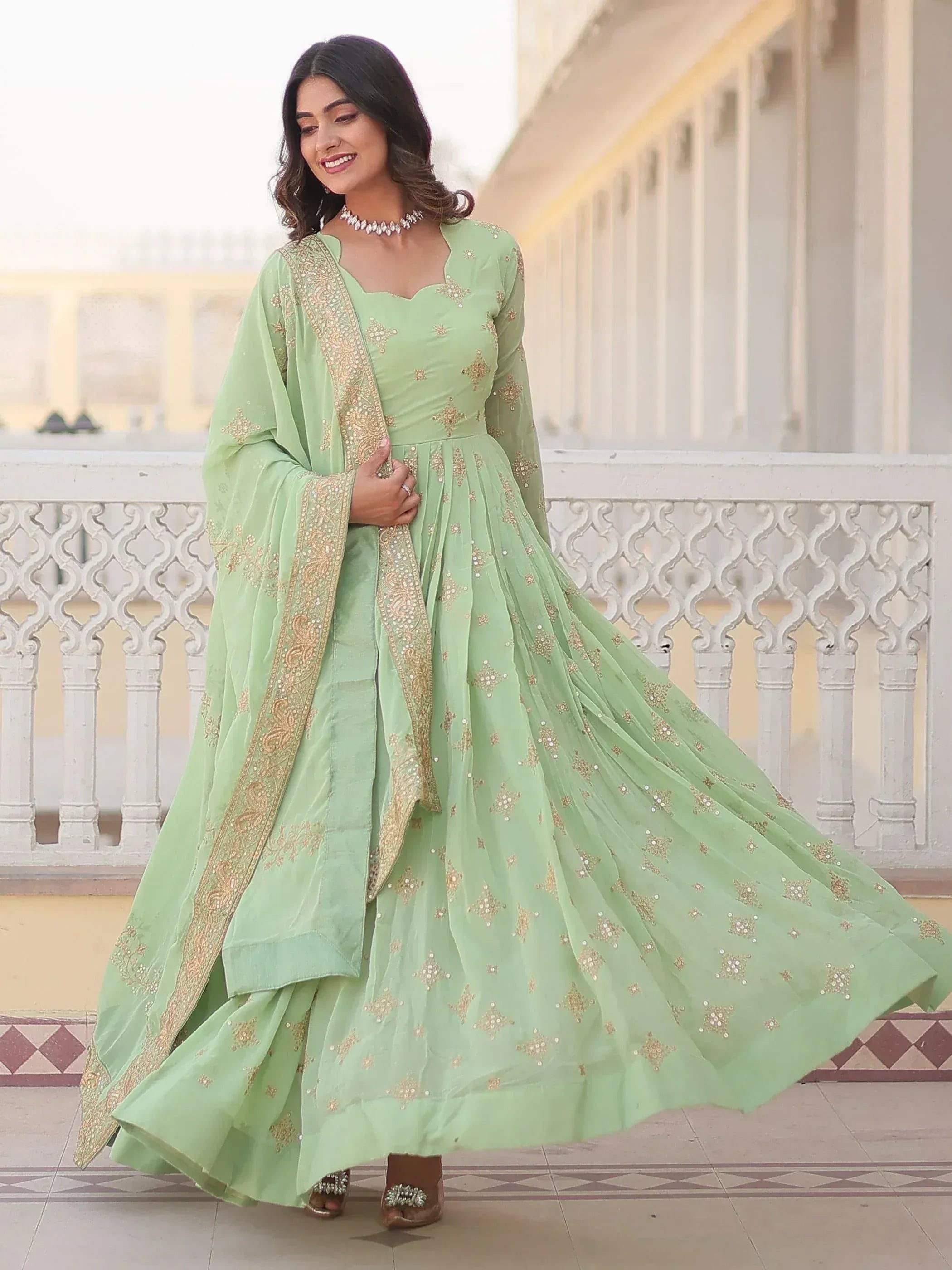 Mint green embroidered anarkali suit with gold detailing, perfect for Indian ethnic occasions