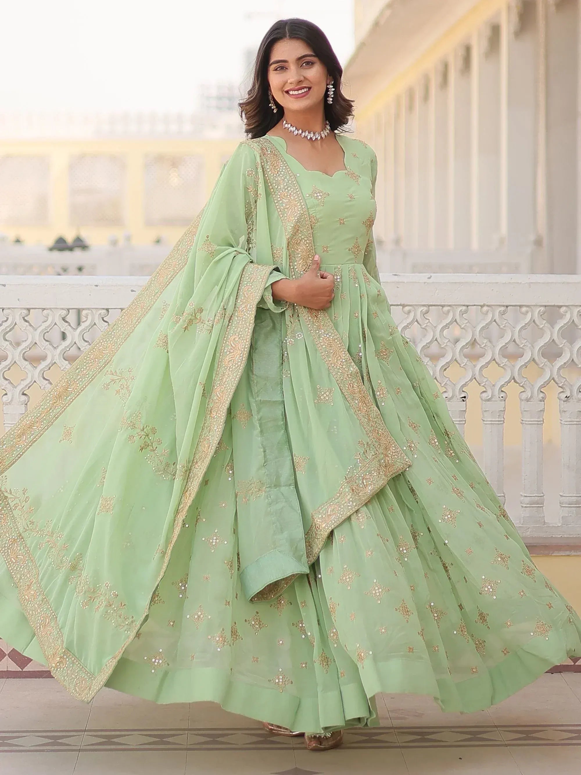 Mint green embroidered lehenga choli with gold detailing, perfect for Indian ethnic wear occasions