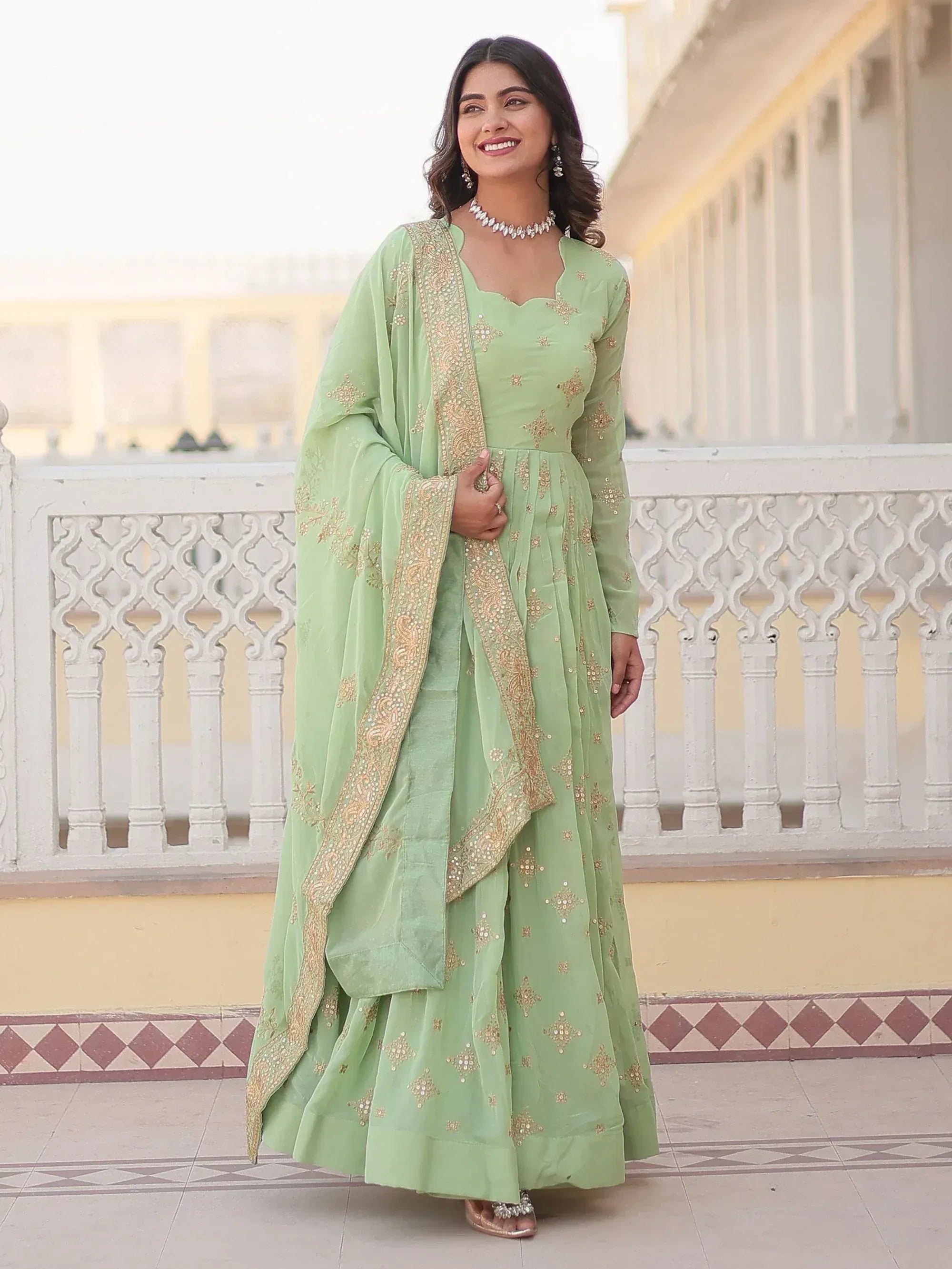 Mint green embroidered anarkali suit with gold detailing, perfect for Indian ethnic wear occasions.