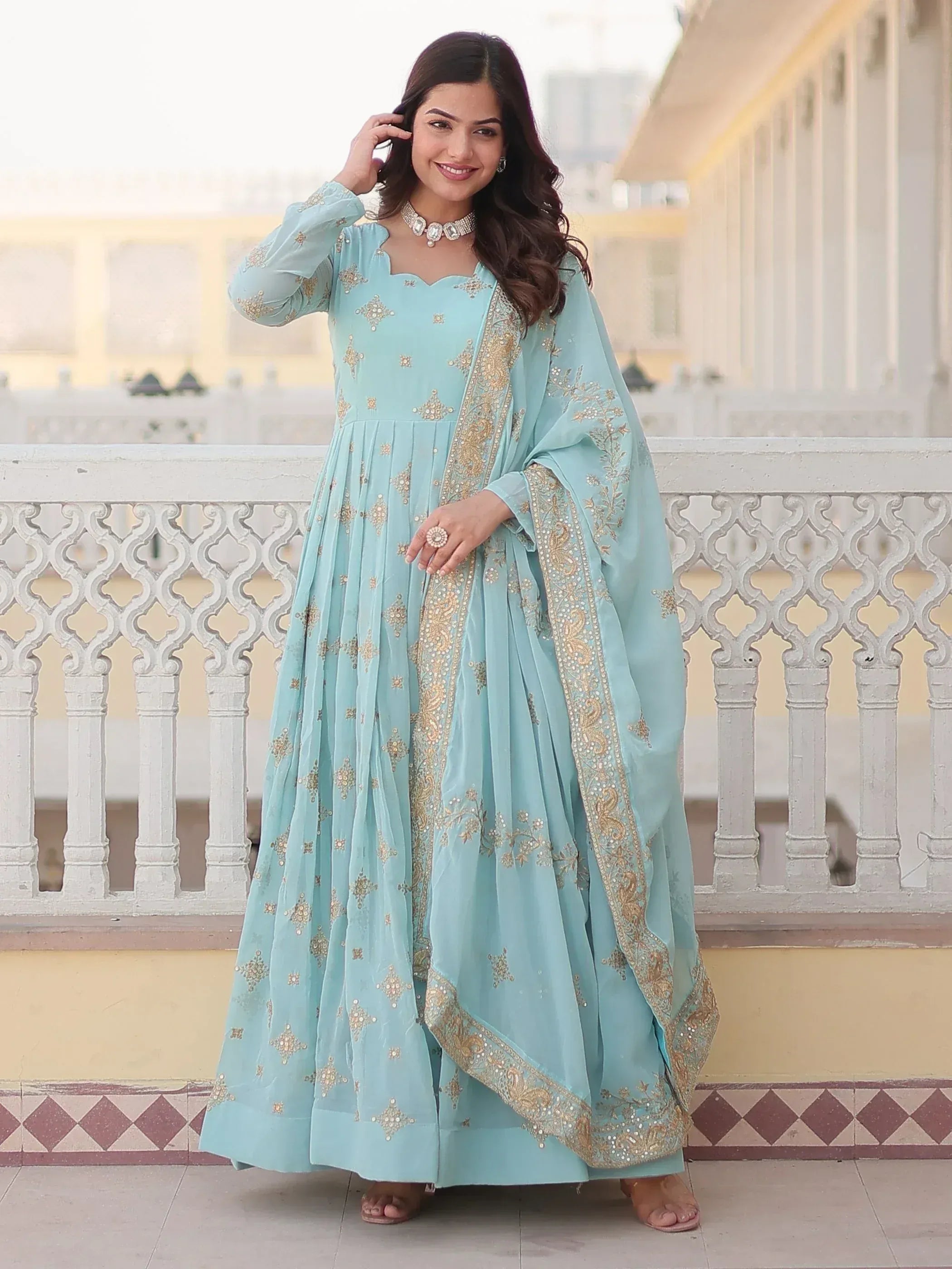 Light blue embroidered anarkali suit with gold detailing, perfect for Indian ethnic occasions