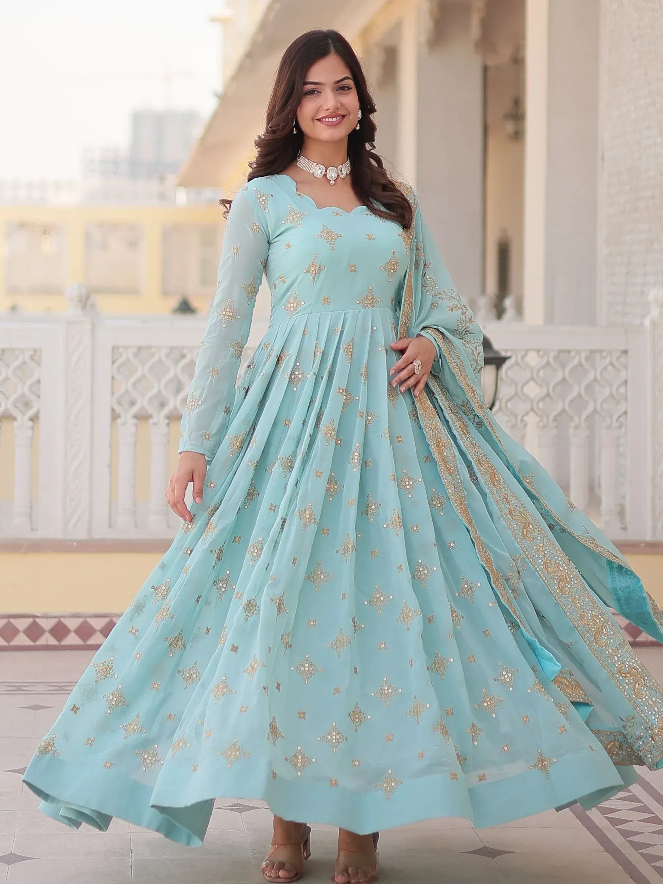 Light blue embroidered anarkali gown with gold detailing, perfect for Indian ethnic occasions