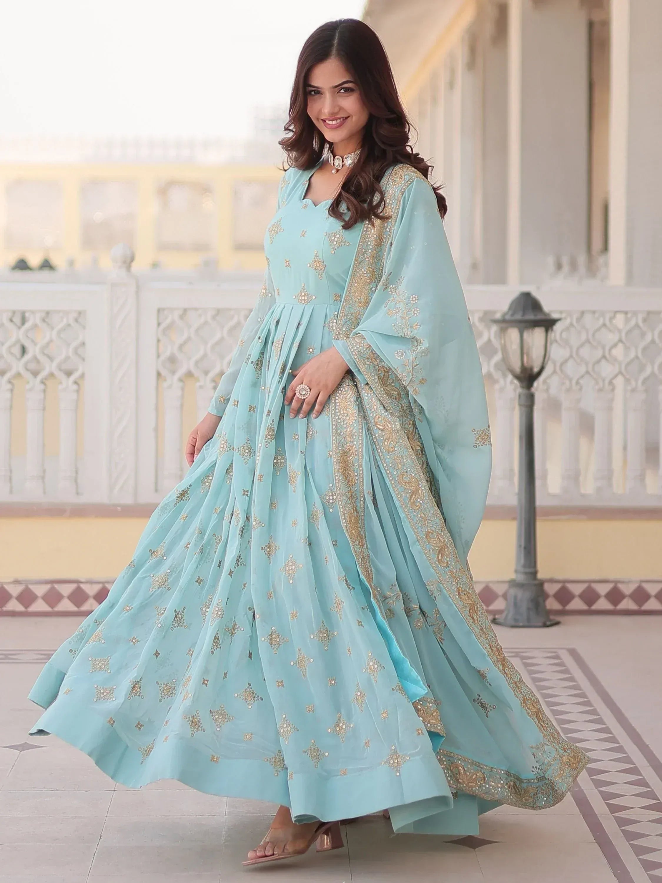Light blue embroidered anarkali suit with gold detailing, perfect for Indian ethnic occasions