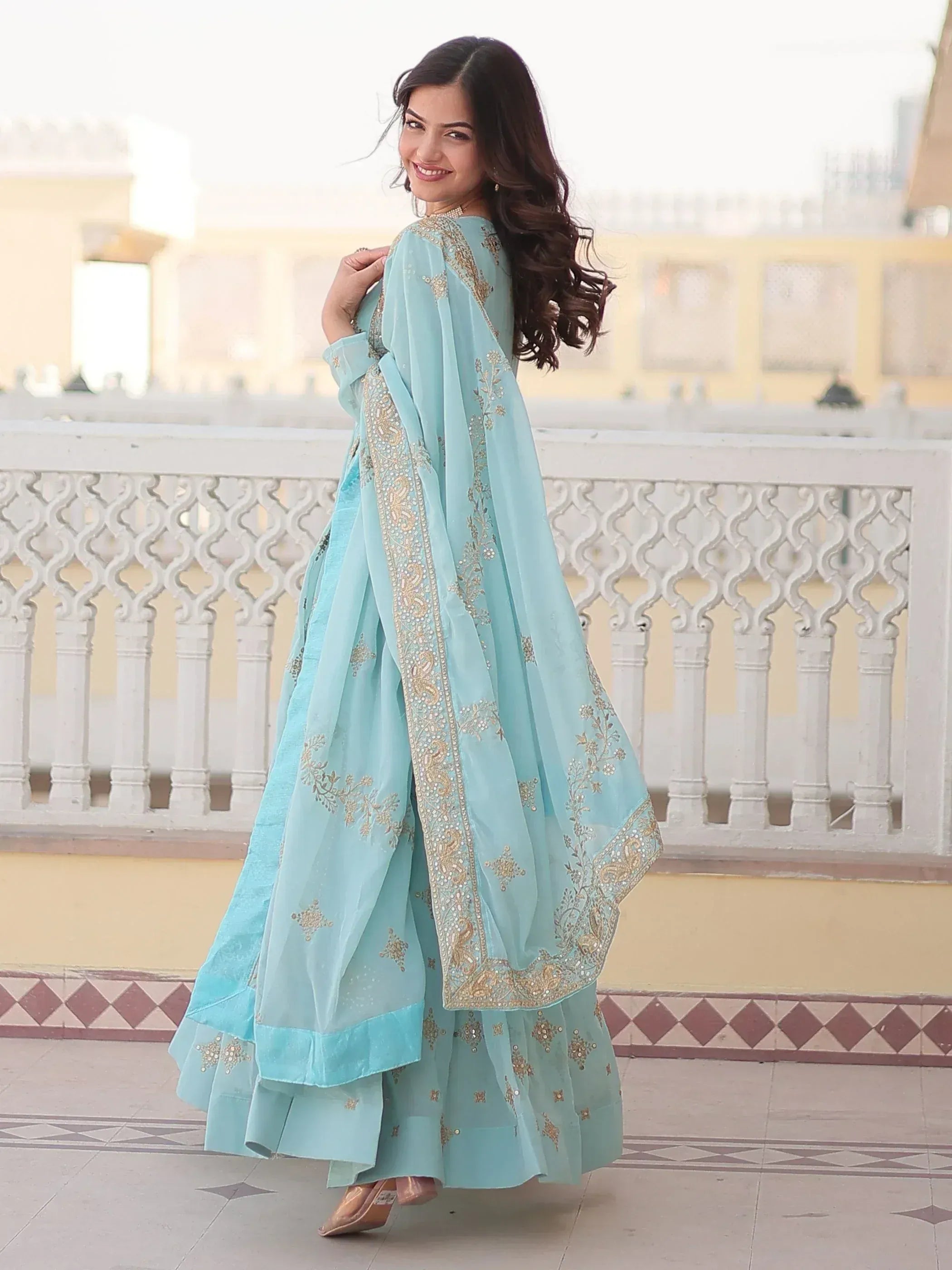 Light blue embroidered salwar kameez with gold detailing, perfect for Indian ethnic occasions