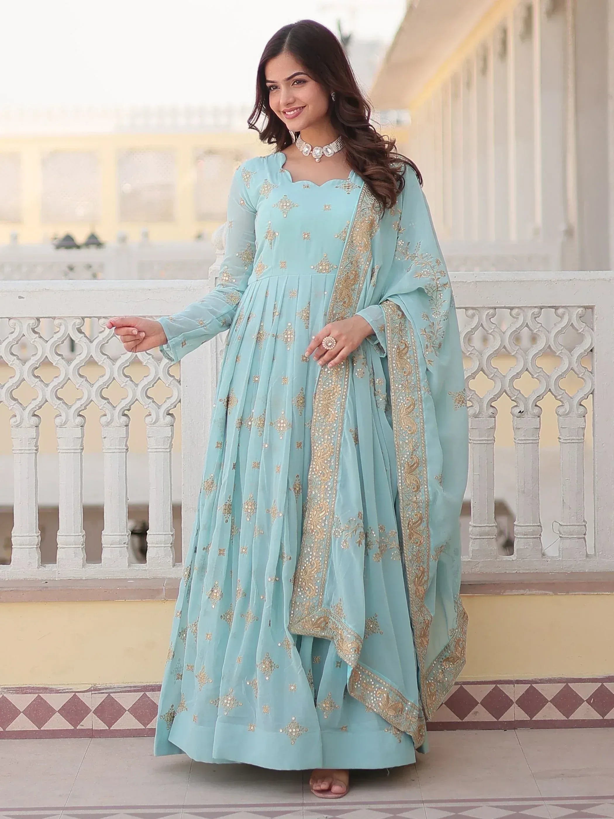Light blue embroidered anarkali suit with gold detailing, perfect for Indian ethnic wear occasions
