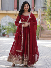 Woman in maroon designer lehenga choli with gold embroidery, Ethnic Plus outdoor shoot