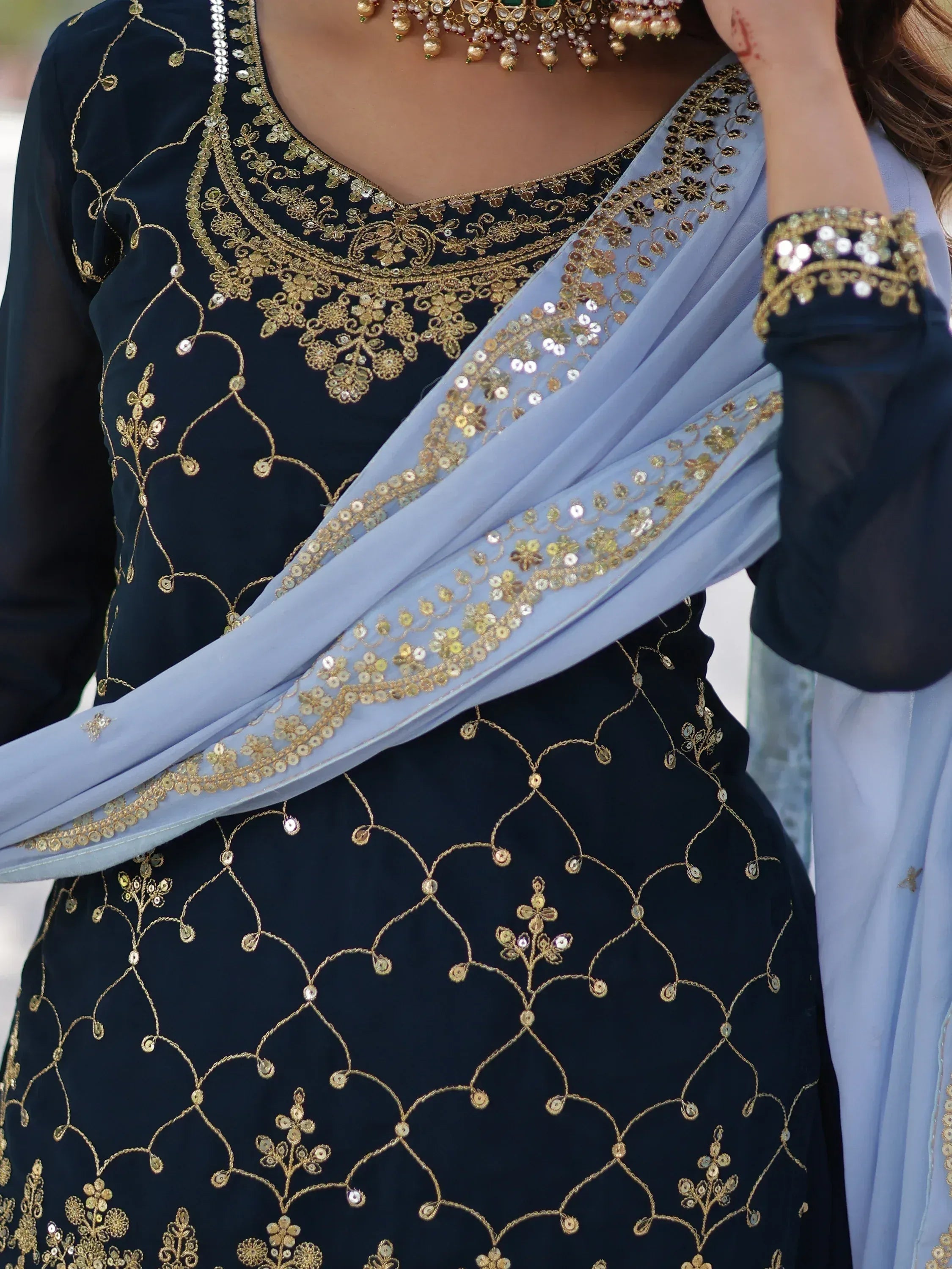 Navy blue embroidered salwar kameez with gold threadwork and light blue dupatta, perfect for Indian ethnic wear.