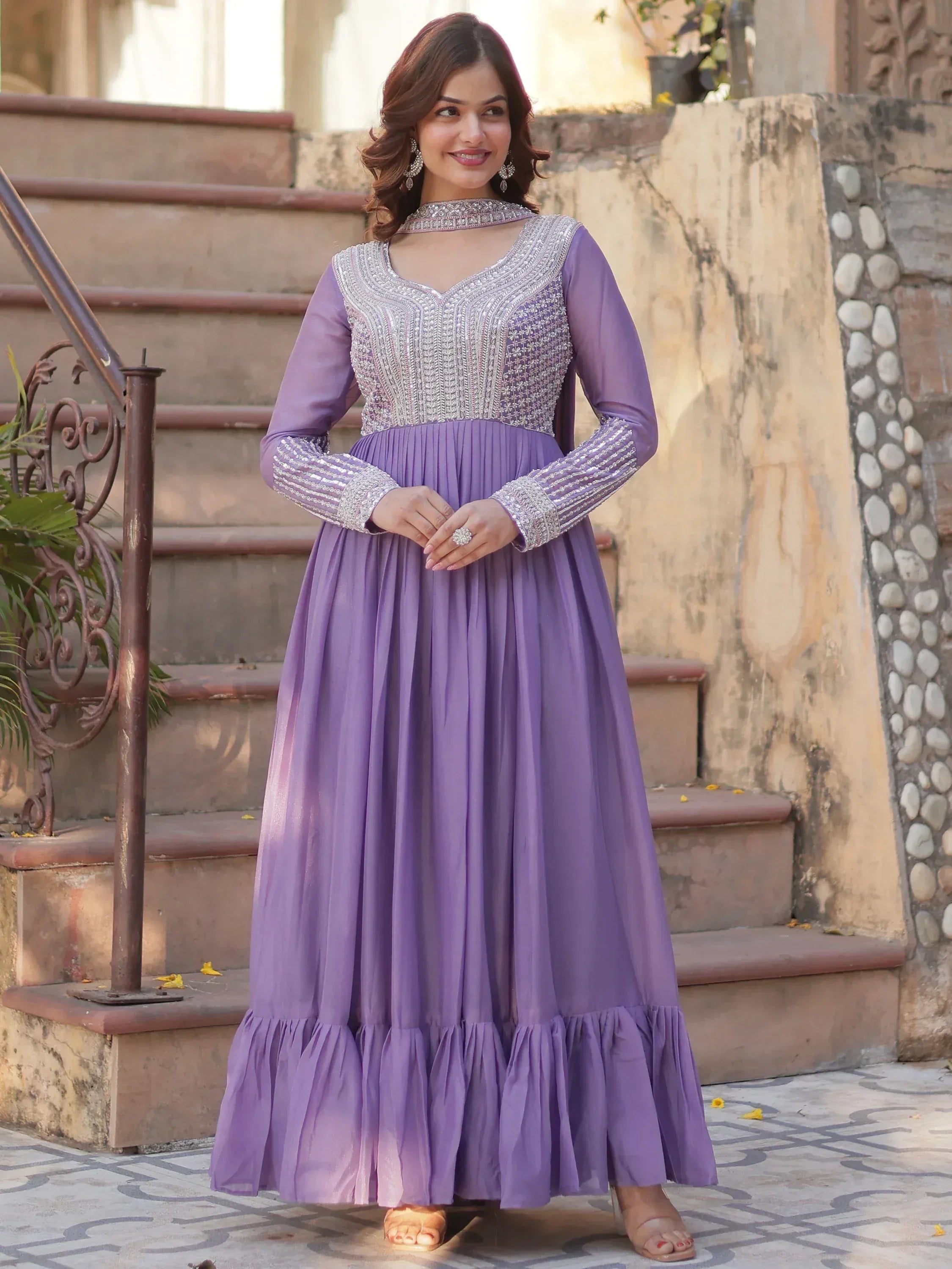 Purple ethnic gown with silver embroidery, long sleeves, and flared hem for women's festive wear