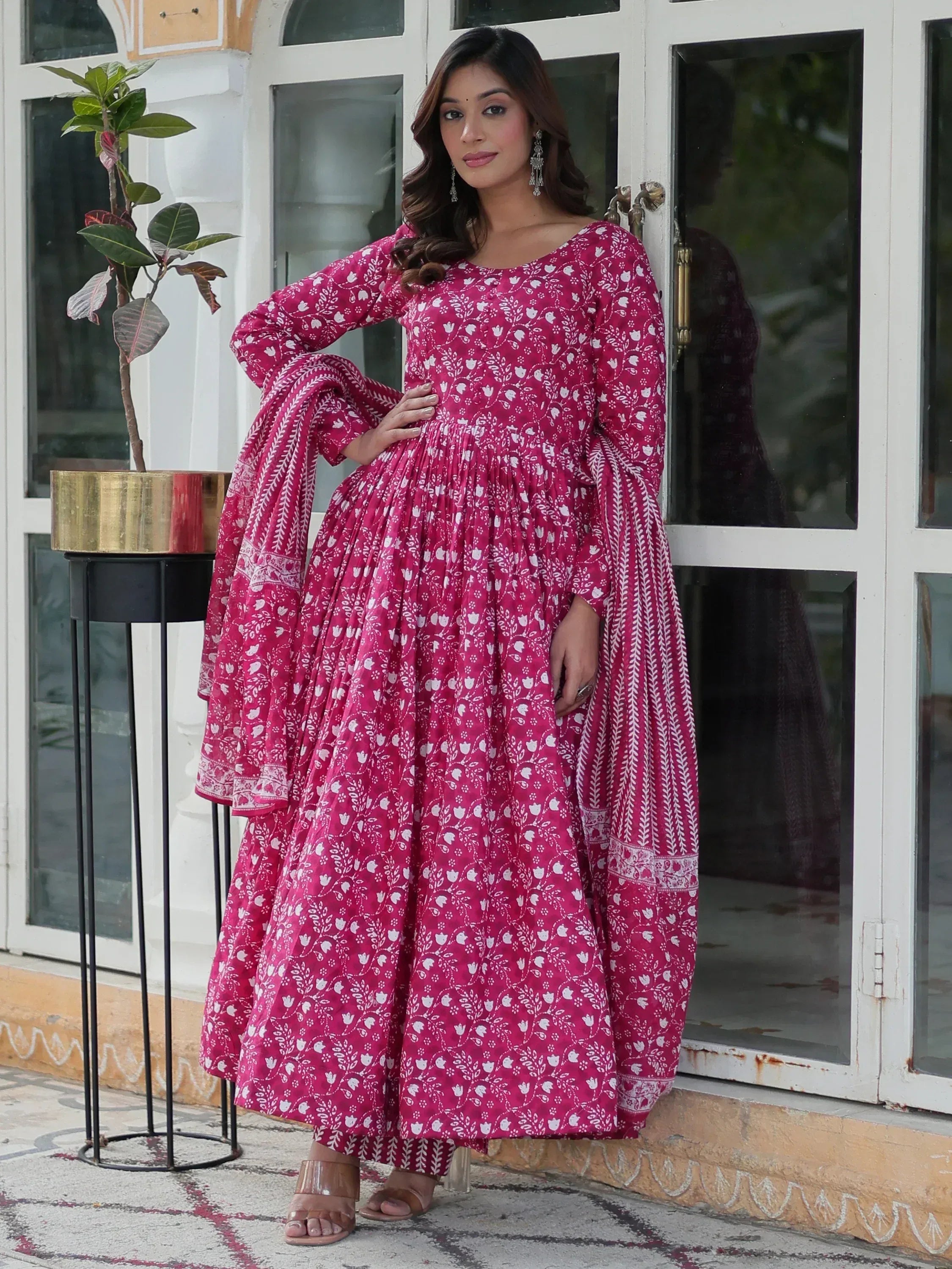 Pink floral print ethnic gown with flared sleeves, perfect for Indian wear occasions