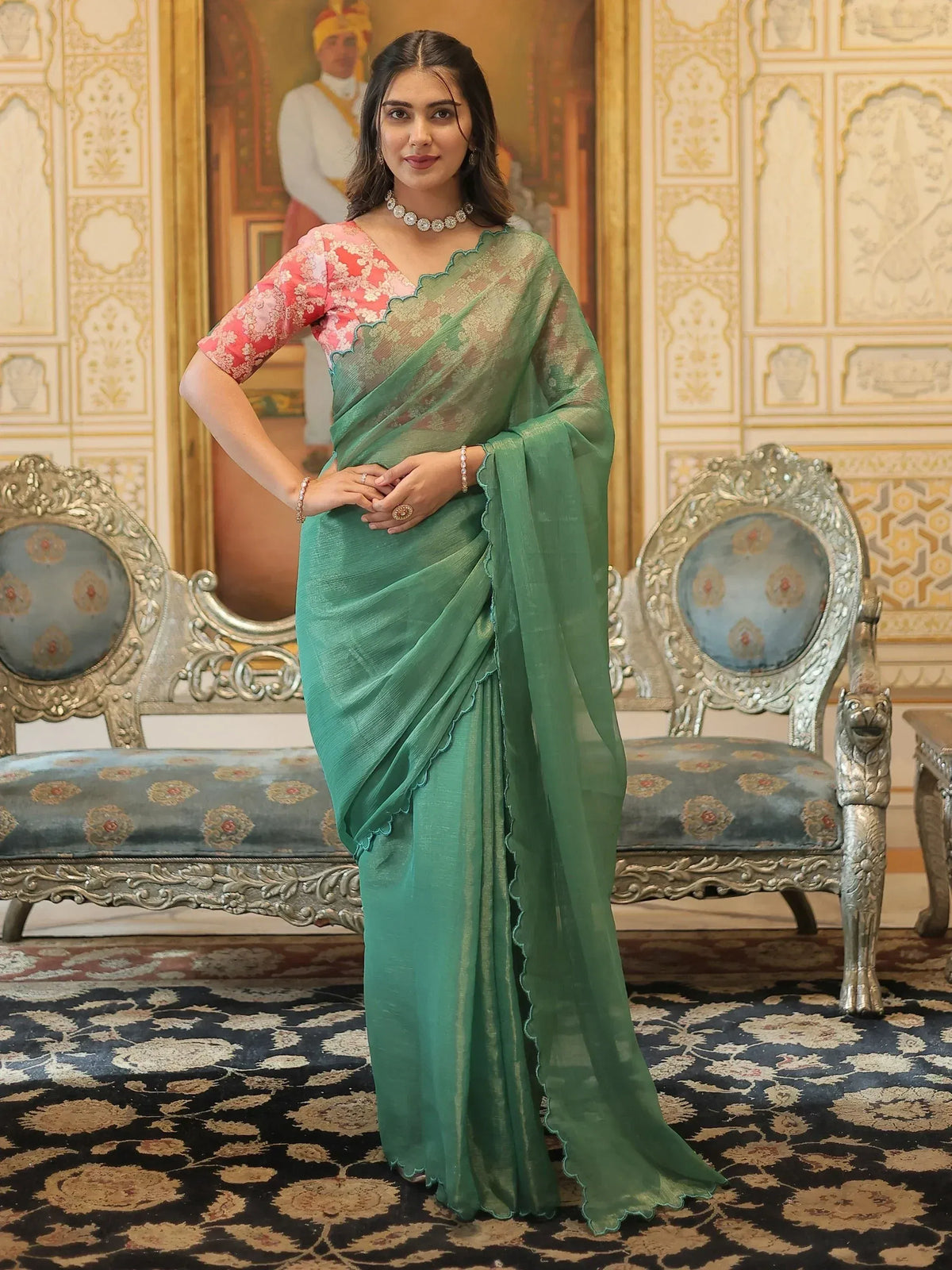 Elegant green saree with scalloped border and floral blouse, perfect for Indian ethnic occasions