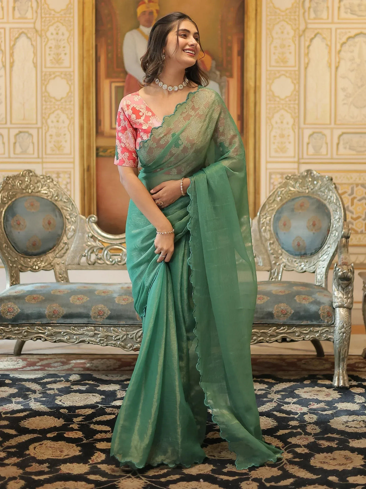 Elegant green saree with scalloped border and floral blouse, perfect for Indian ethnic occasions