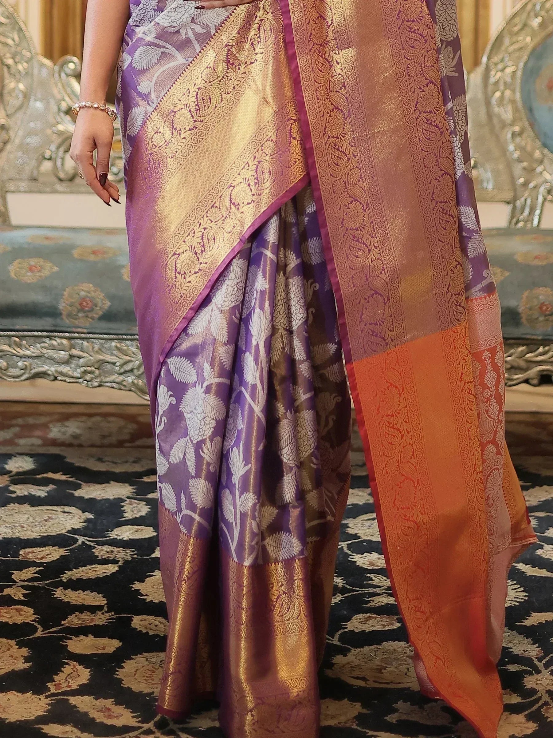 Purple and gold designer saree with floral zari work, perfect for Indian ethnic wear occasions.