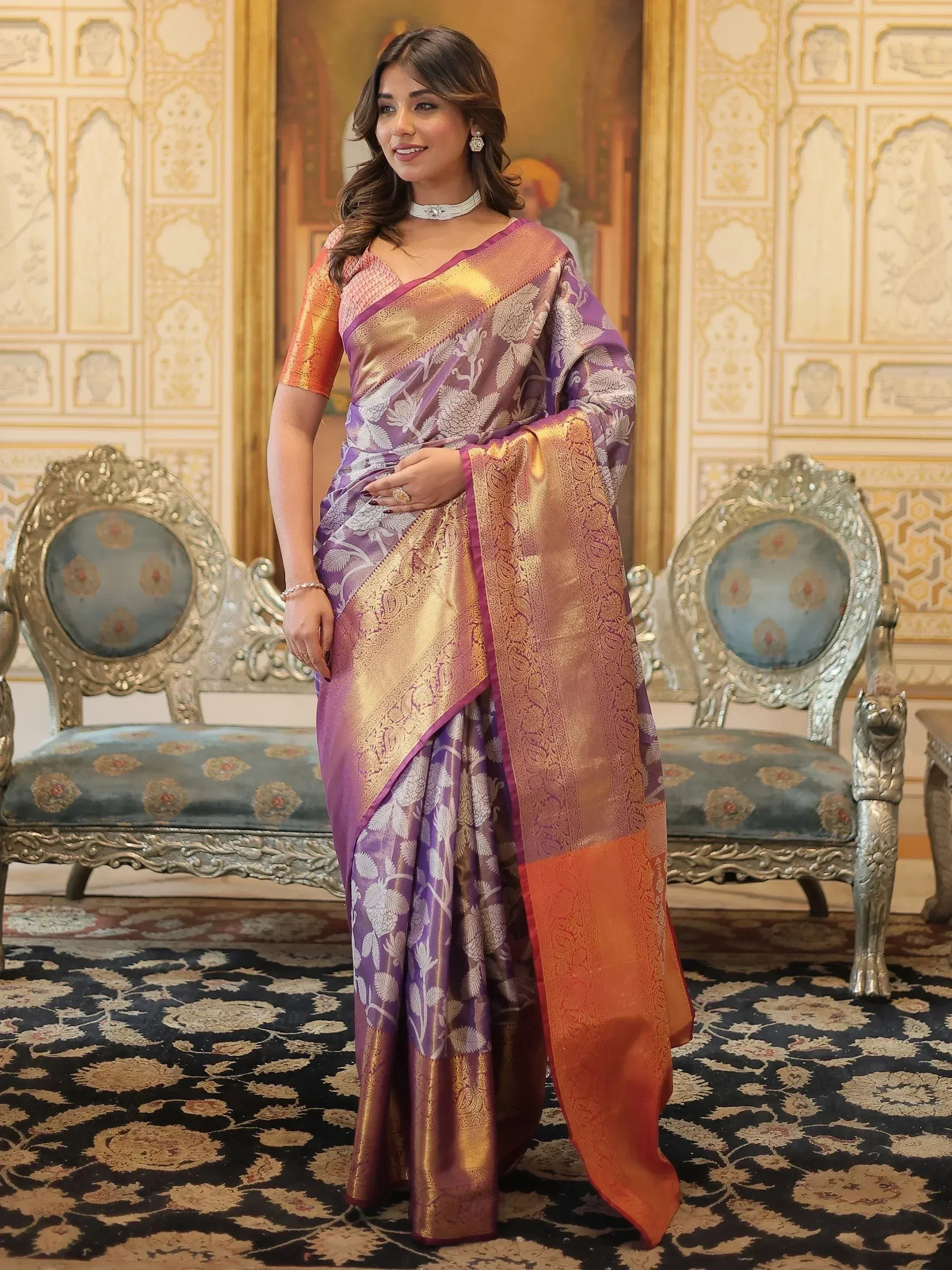 Purple and gold designer saree with floral motifs, perfect for Indian ethnic wear occasions