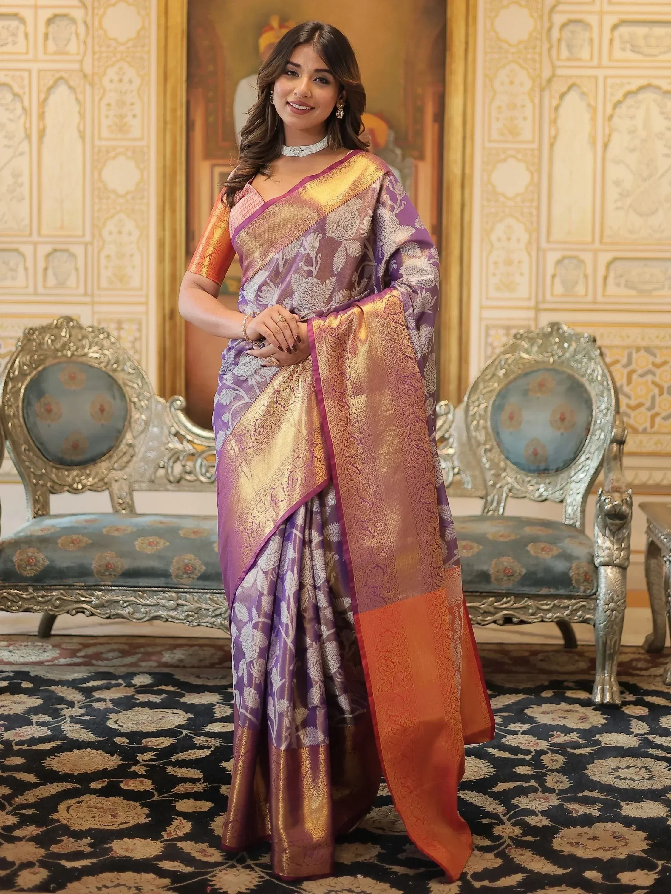 Purple and gold designer saree with floral motifs, perfect for Indian ethnic wear occasions