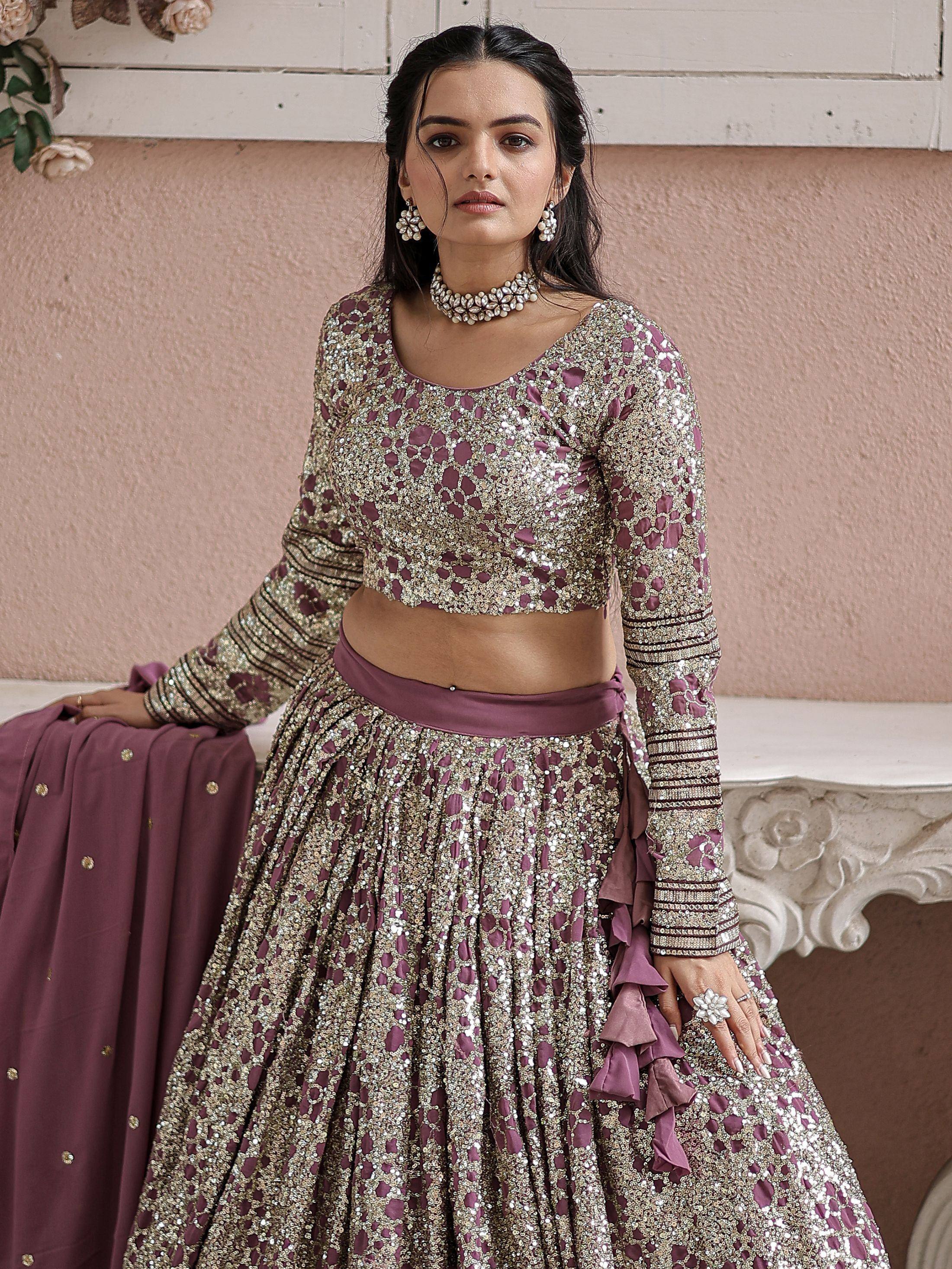 Elegant mauve and gold sequin lehenga choli with ruffle detailing, perfect for Indian weddings and festive occasions.