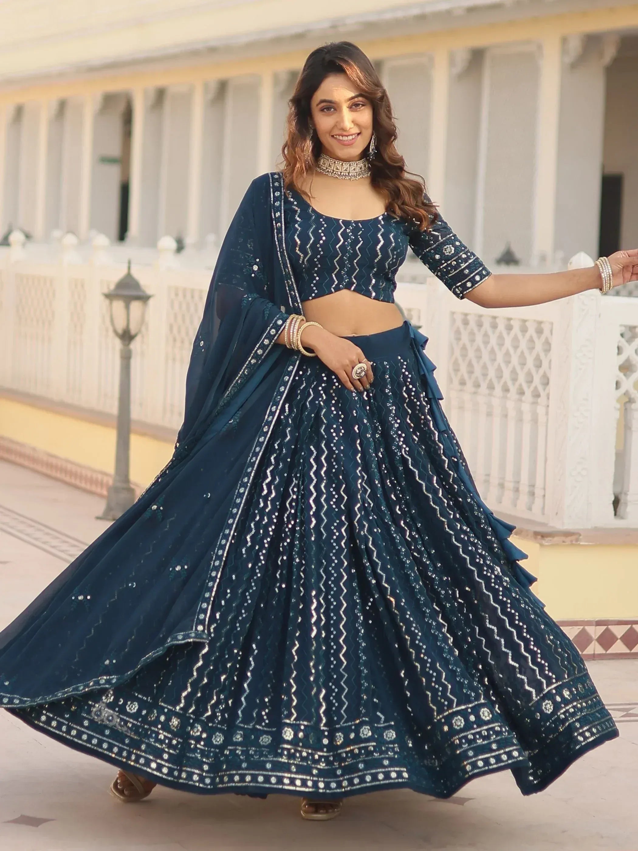 Elegant navy blue lehenga choli with silver embroidery, perfect for Indian ethnic wear and festive occasions.