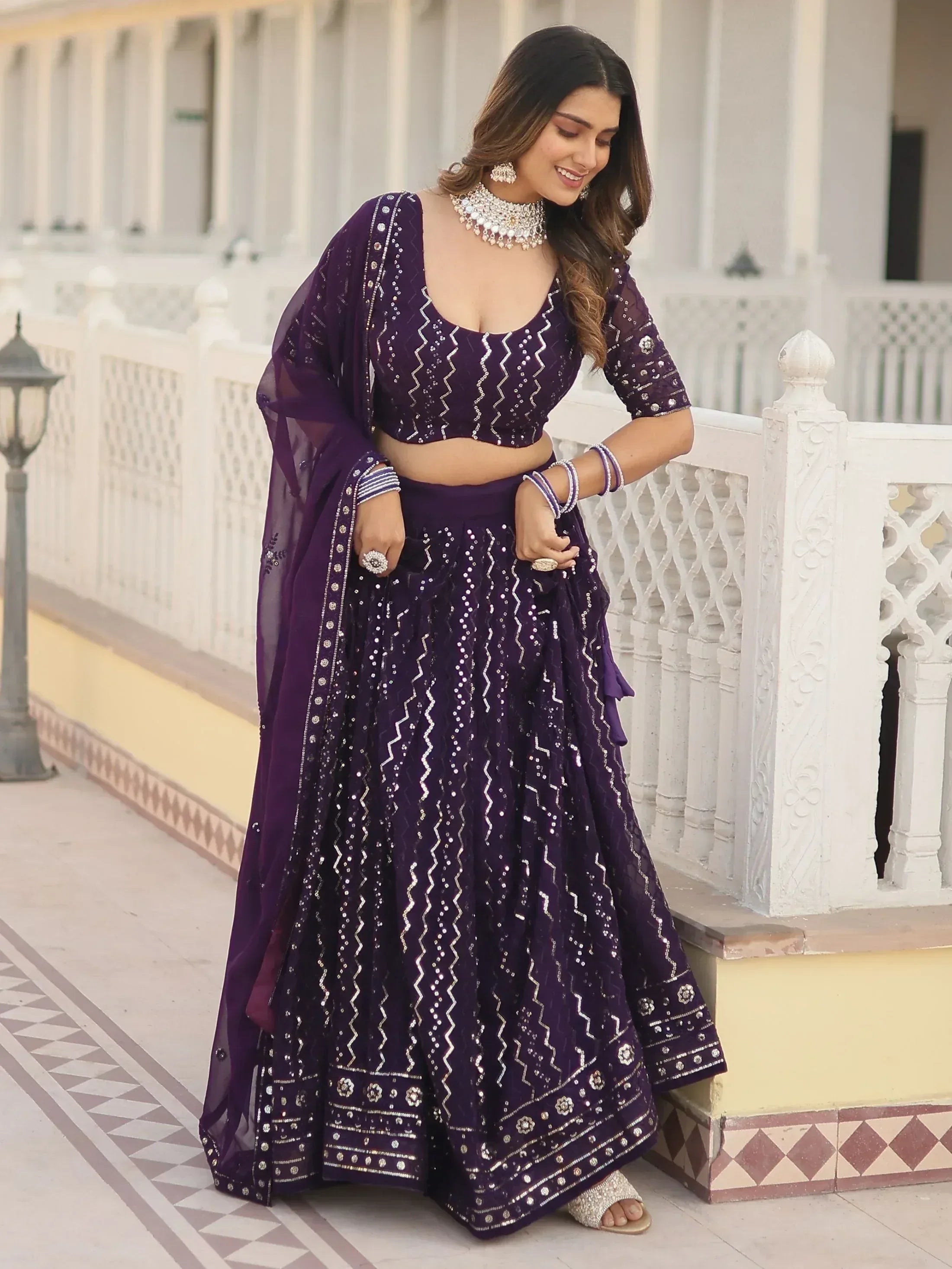 Purple designer lehenga choli with silver embroidery, perfect for Indian ethnic wear events
